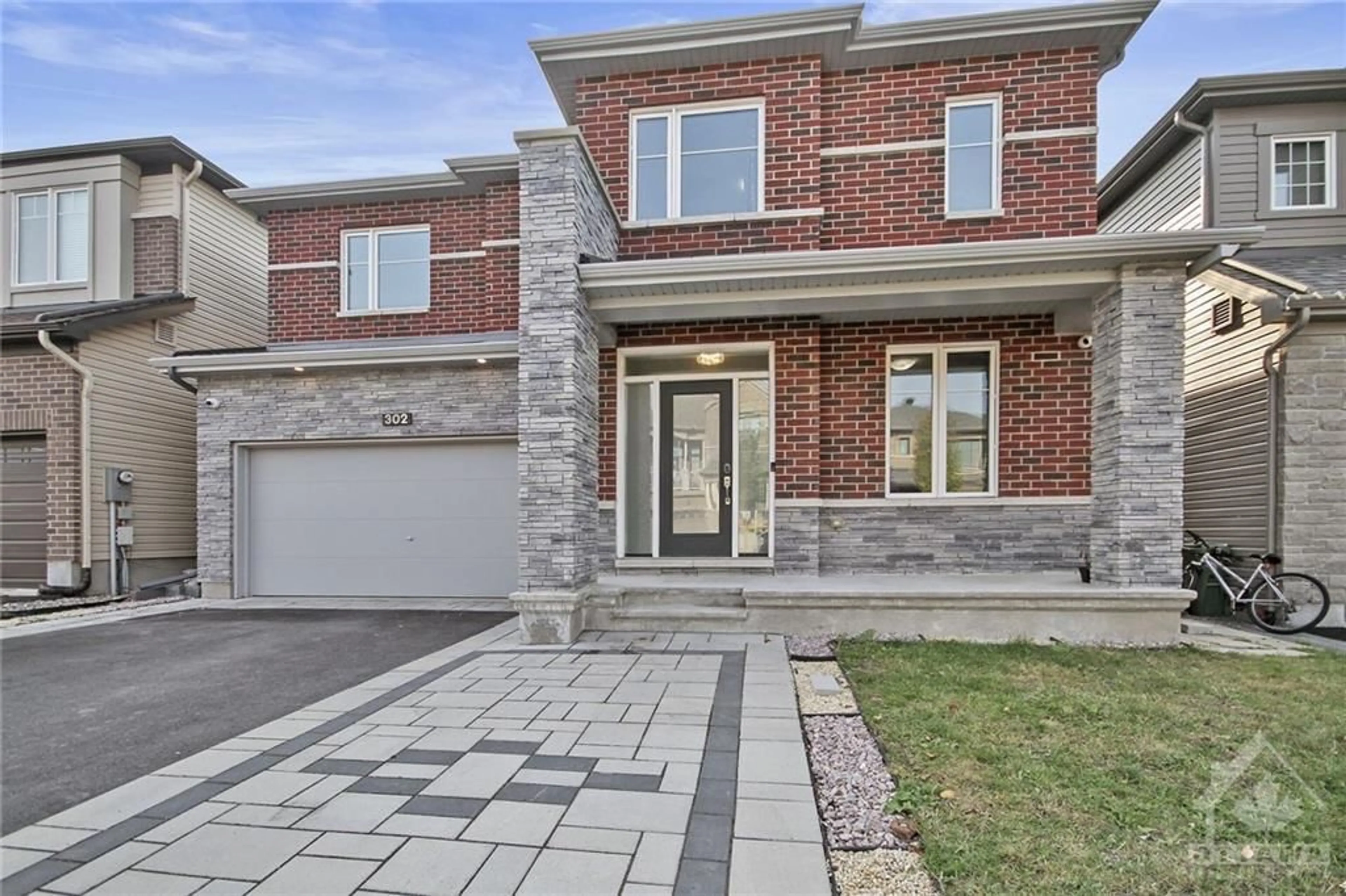 Home with brick exterior material for 302 EAGLEHEAD Cres, Ottawa Ontario K2S 2H9