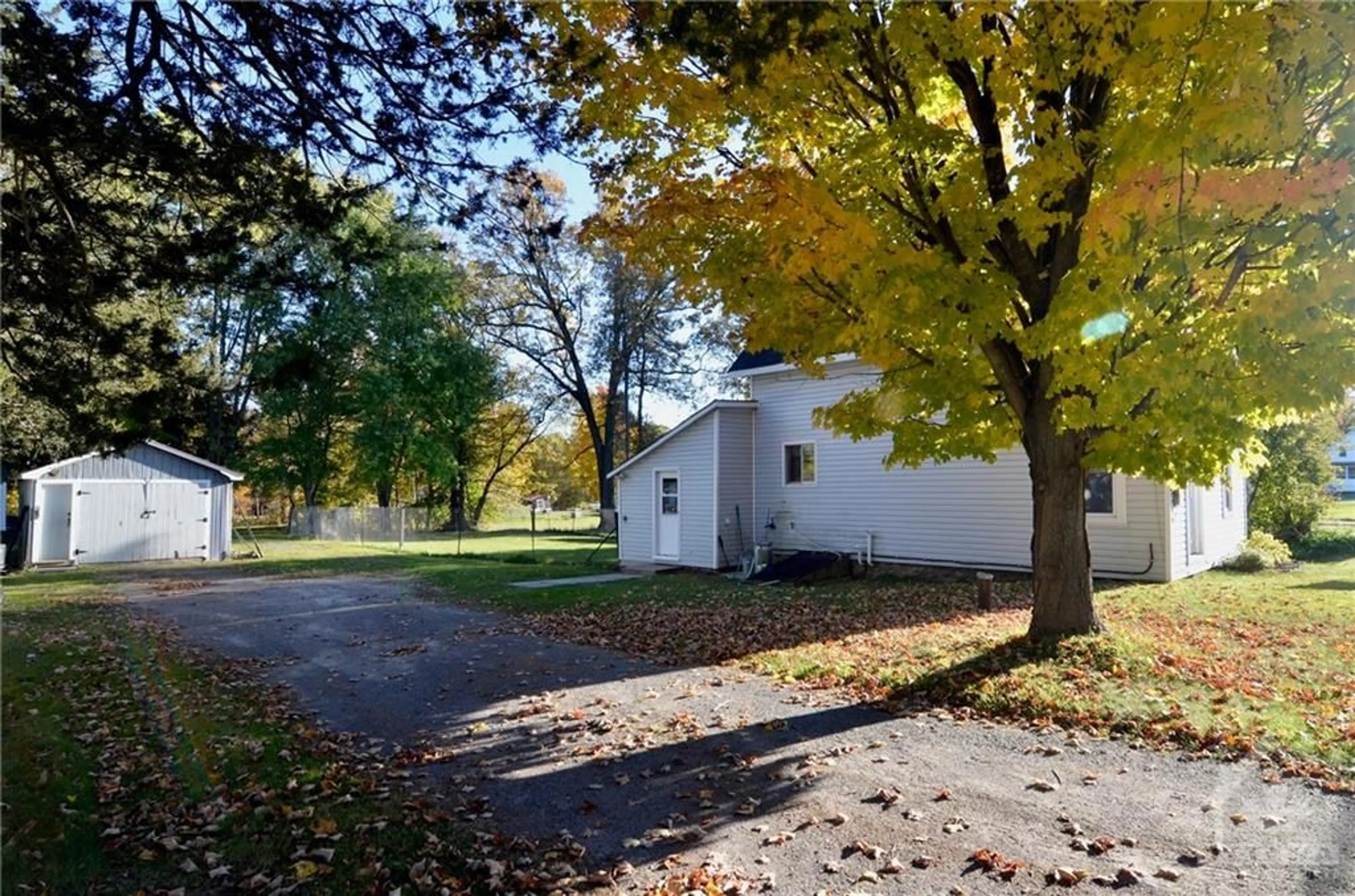 A pic from exterior of the house or condo, the fenced backyard for 36 DRUMMOND St, Newboro Ontario K0G 1V0