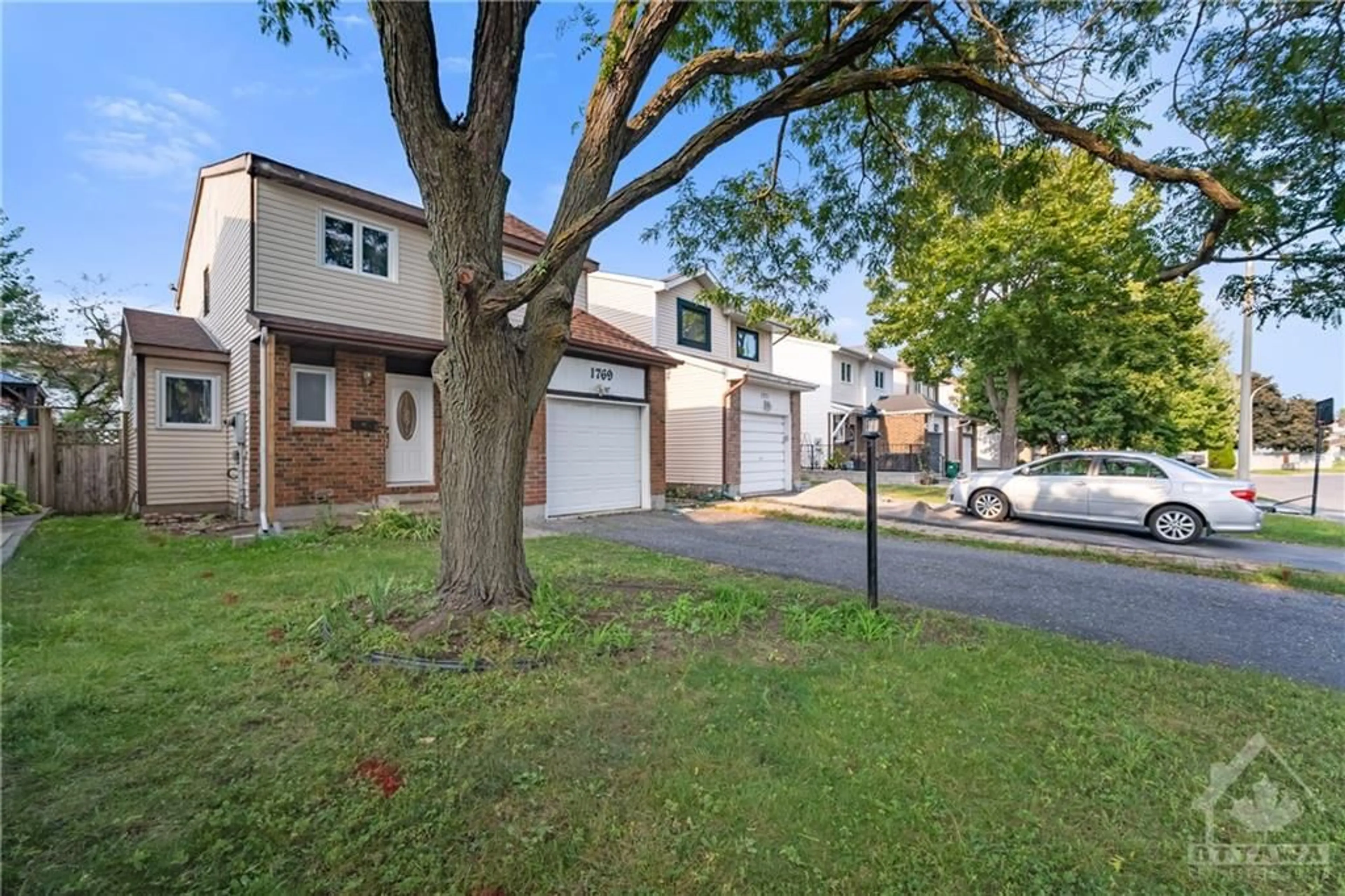 A pic from exterior of the house or condo, the fenced backyard for 1769 BROMONT Way, Ottawa Ontario K1C 5K1