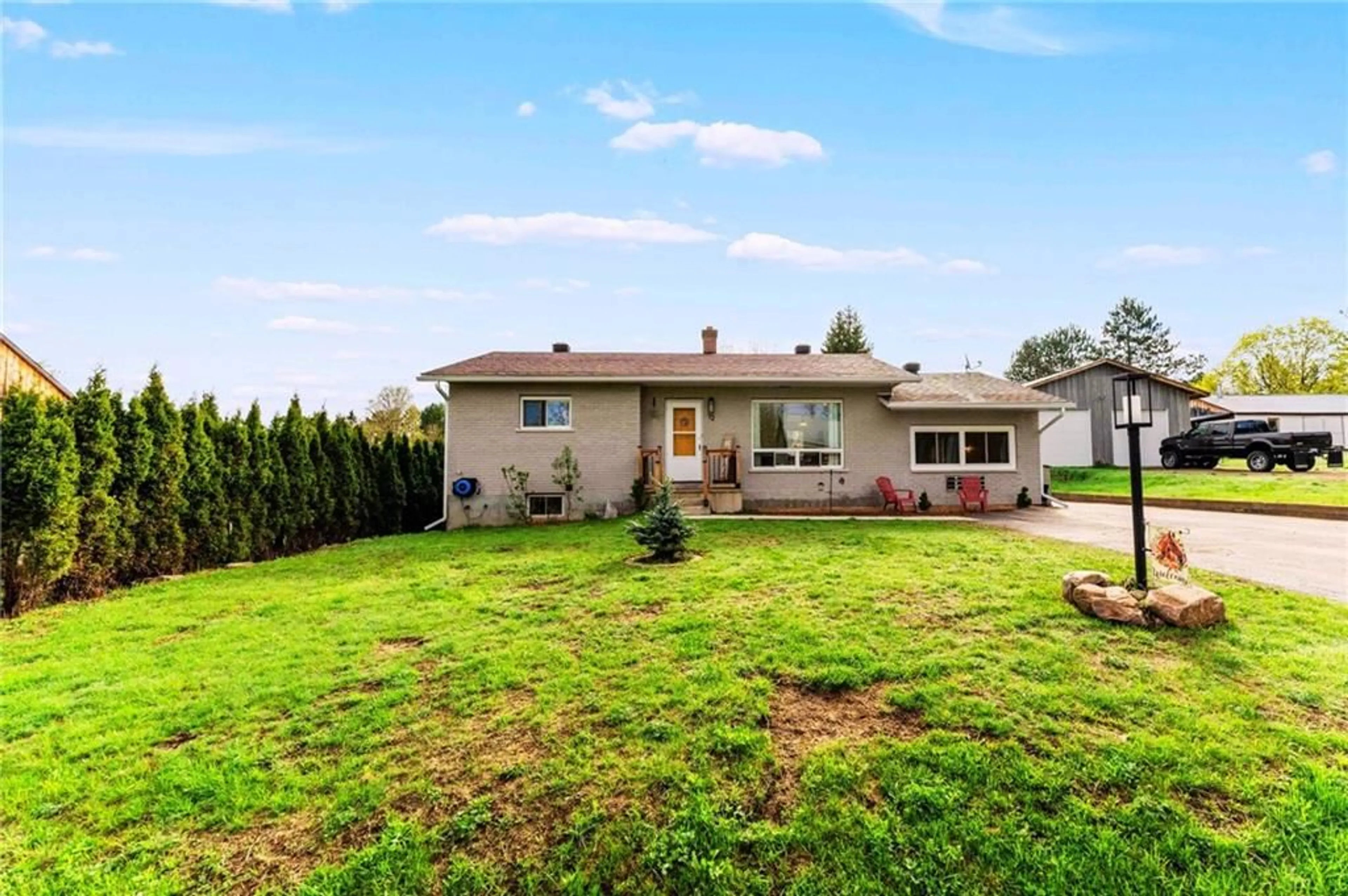 Frontside or backside of a home, the fenced backyard for 12 LISK St, Killaloe Ontario K0J 2A0