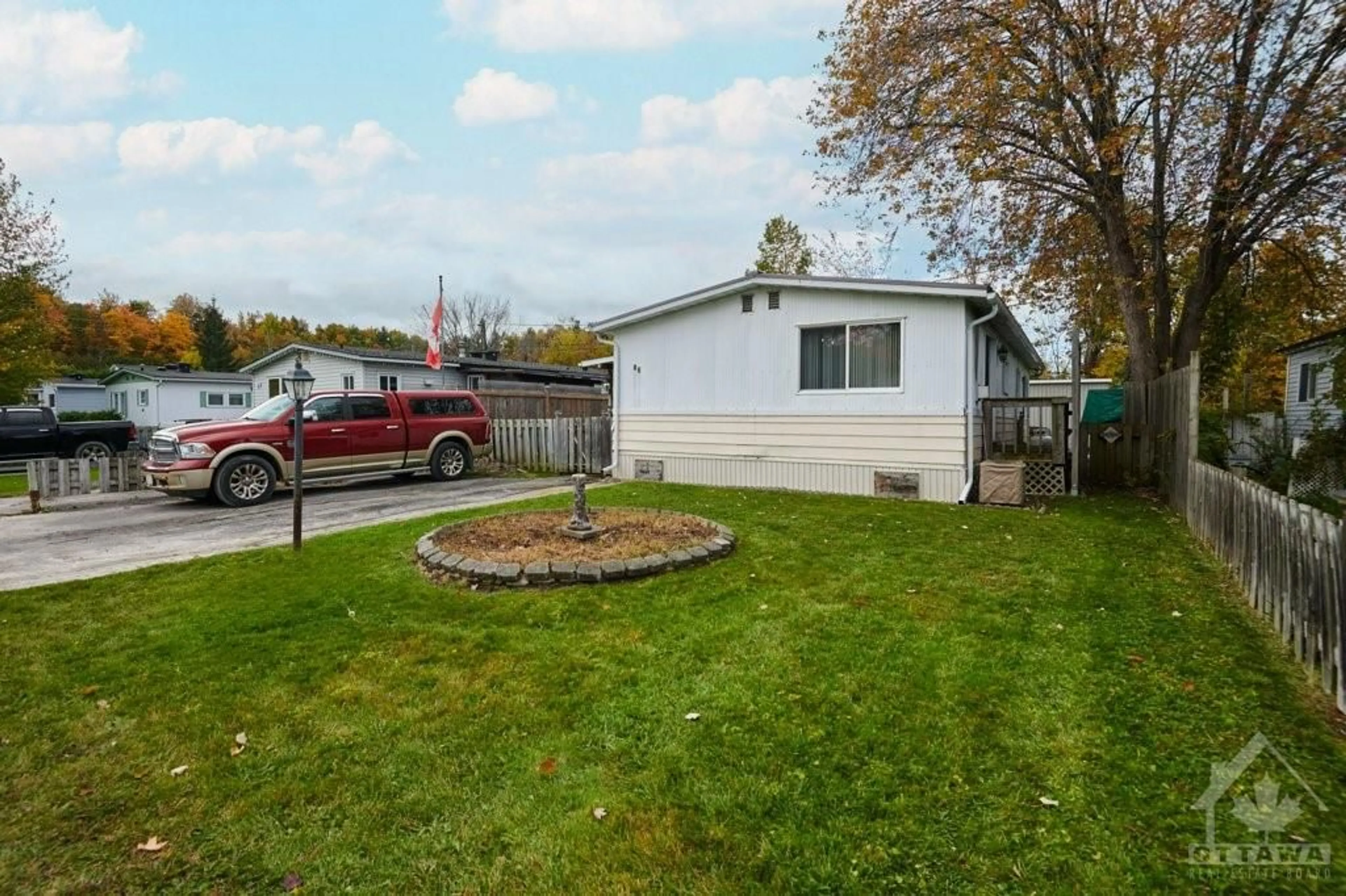 A pic from exterior of the house or condo, the fenced backyard for 3535 ST JOSEPH Blvd #86, Orleans Ontario K4A 0Z6