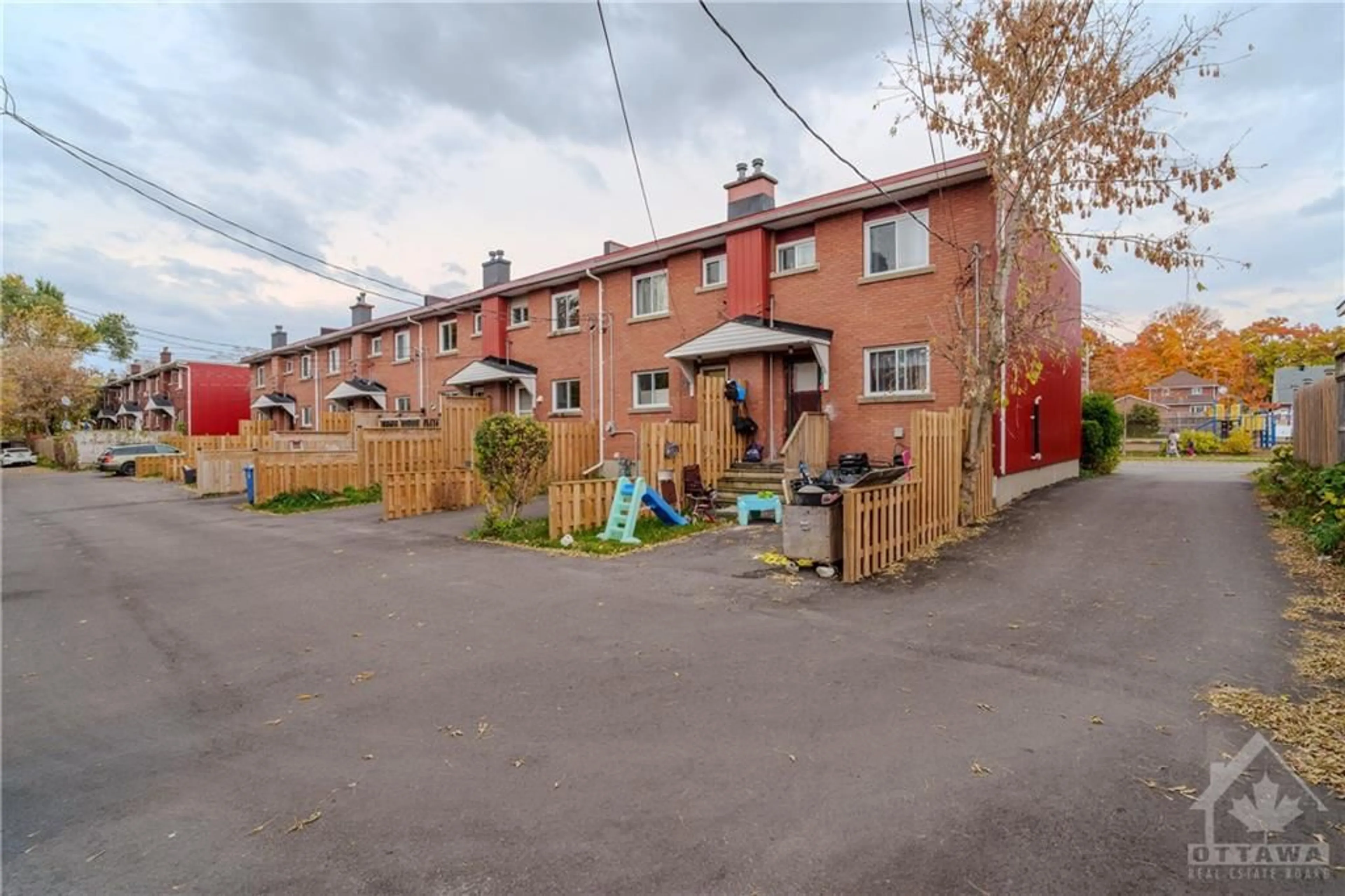 Frontside or backside of a home, the fenced backyard for 1313A COLDREY Ave, Ottawa Ontario K1Z 7P6