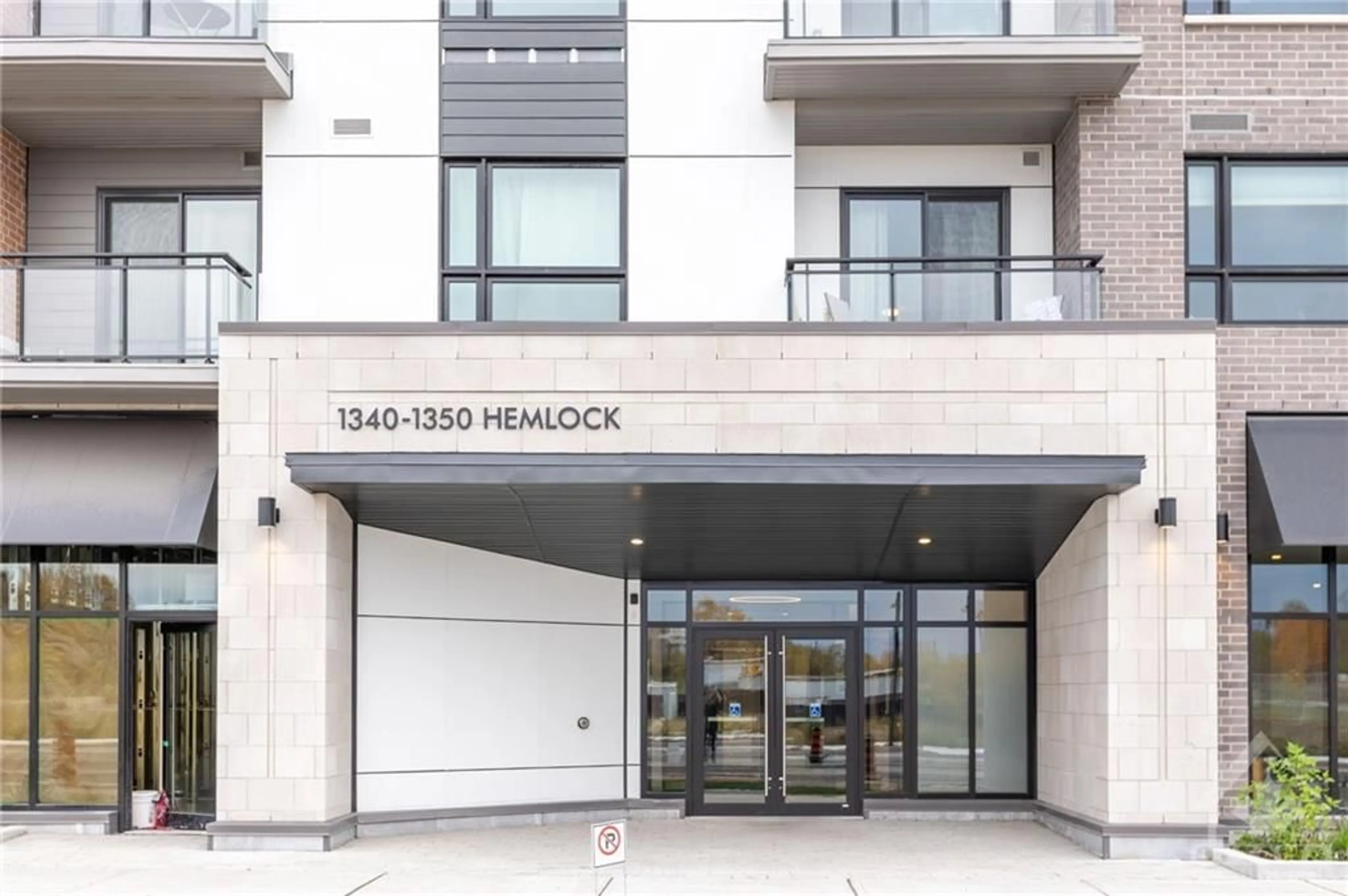 A pic from exterior of the house or condo, the front or back of building for 1350 HEMLOCK Rd #301, Ottawa Ontario K1K 5C2