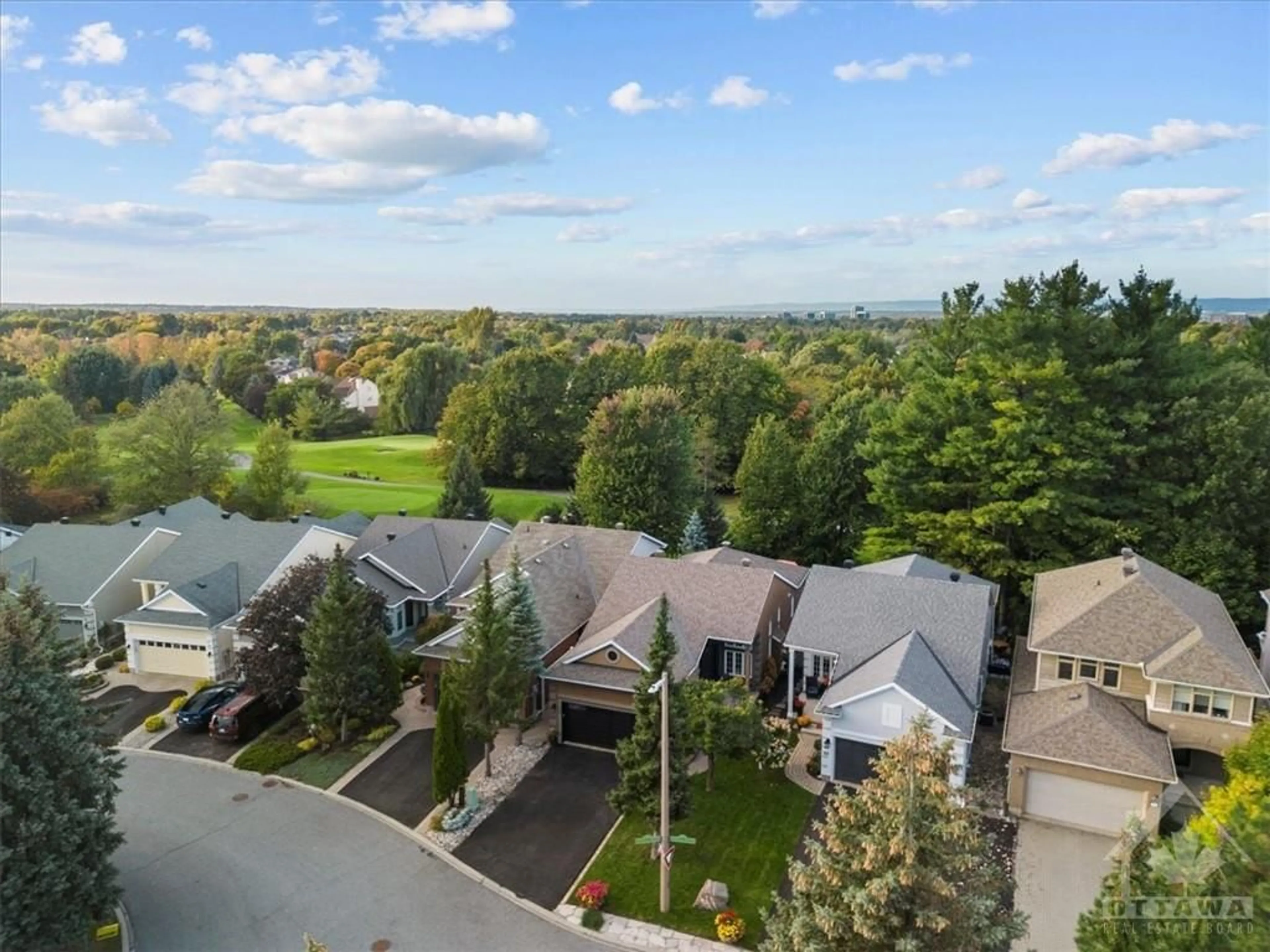 A pic from exterior of the house or condo, the fenced backyard for 54 STONECROFT Terr, Ottawa Ontario K2K 2T9