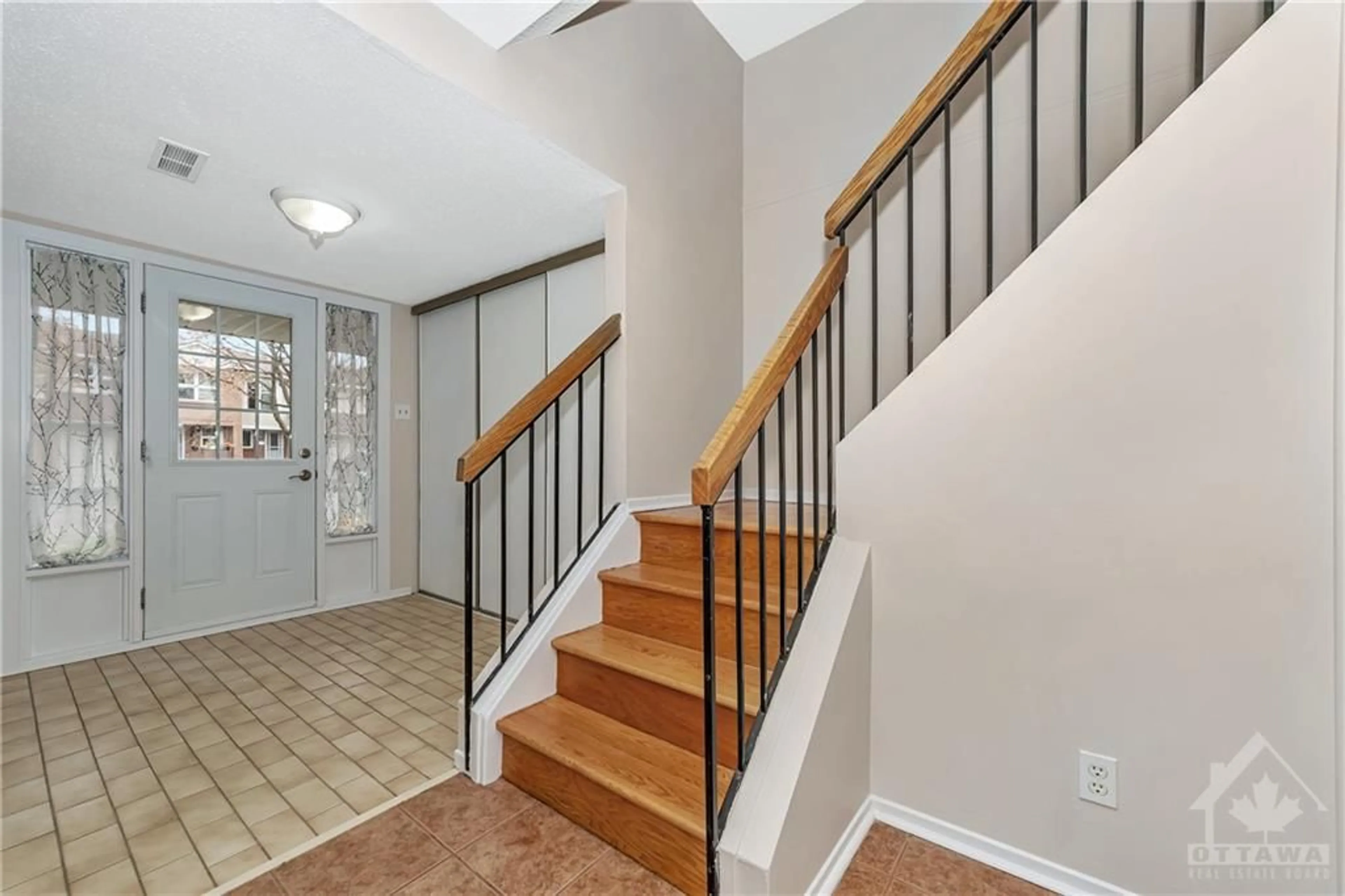 Indoor foyer, wood floors for 9 CASTLEBROOK Lane #C, Ottawa Ontario K2G 5G1