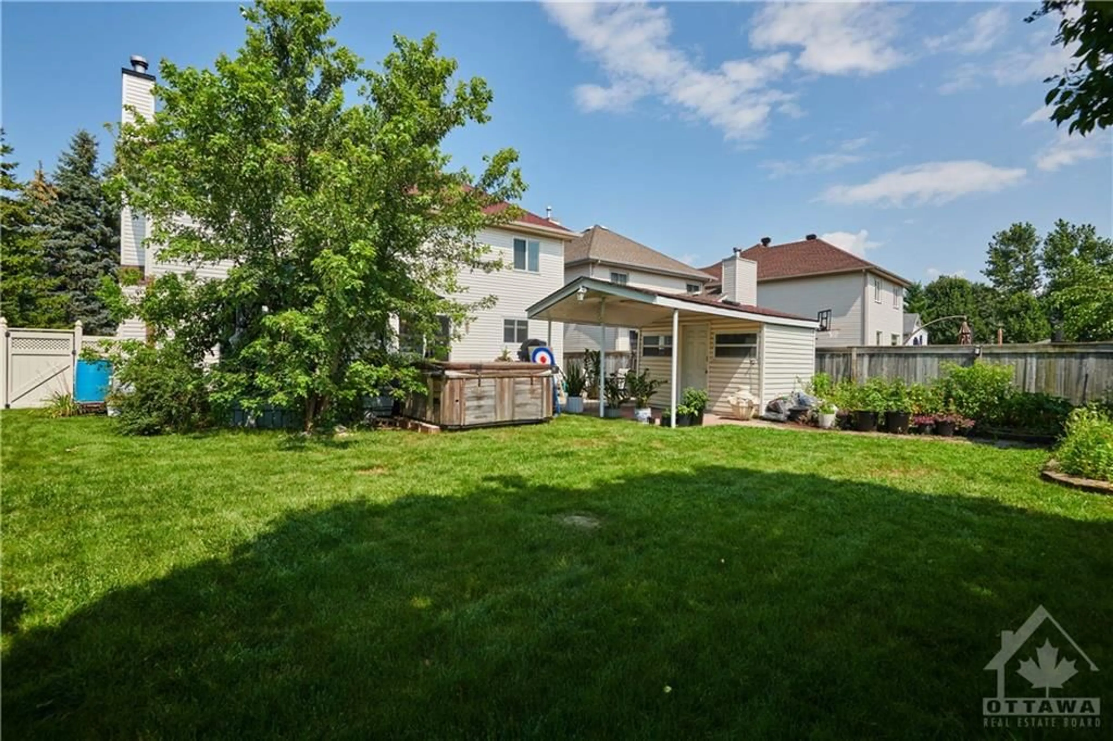 Frontside or backside of a home, the fenced backyard for 883 CLEARCREST Cres, Ottawa Ontario K4A 3E6