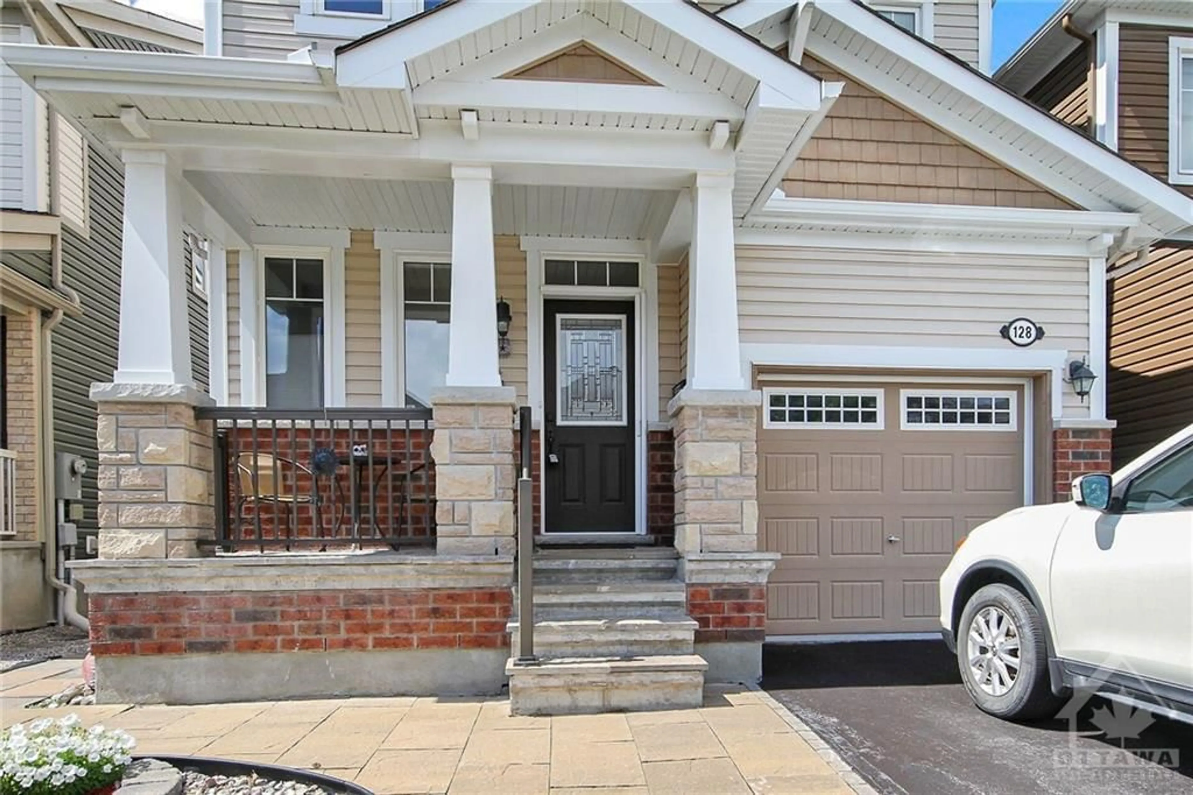 Home with brick exterior material for 128 LILY POND St, Ottawa Ontario K2M 0J3