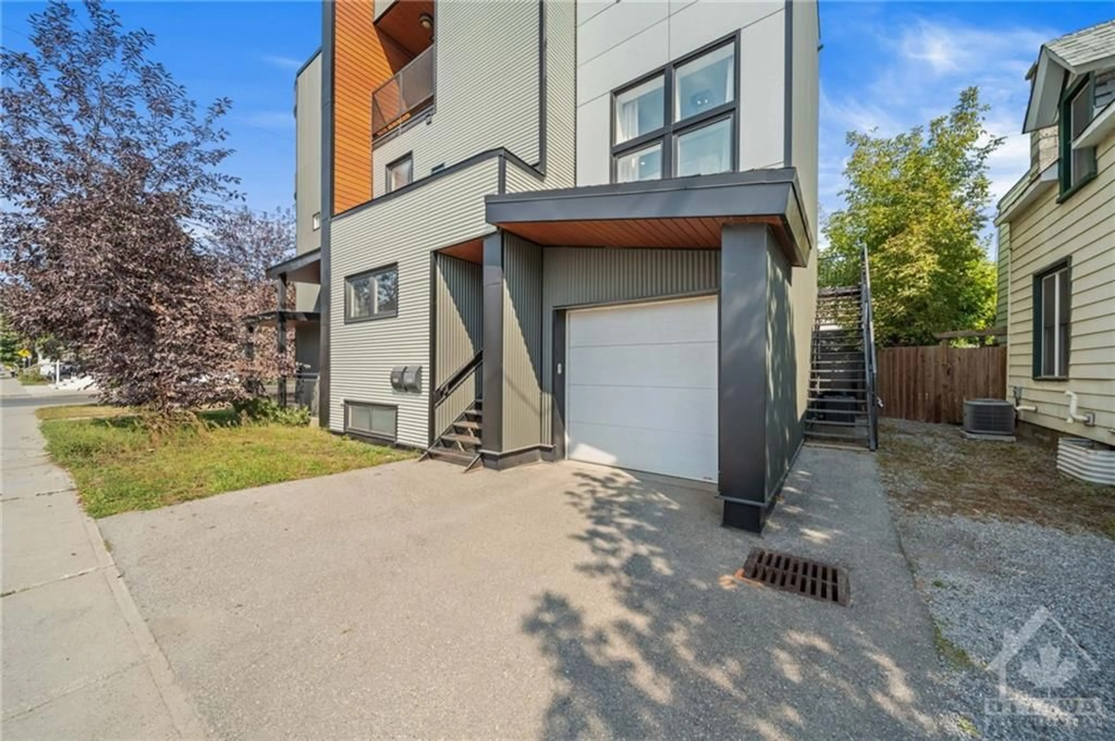 A pic from exterior of the house or condo, the fenced backyard for 469 BOOTH St, Ottawa Ontario K1R 7L1