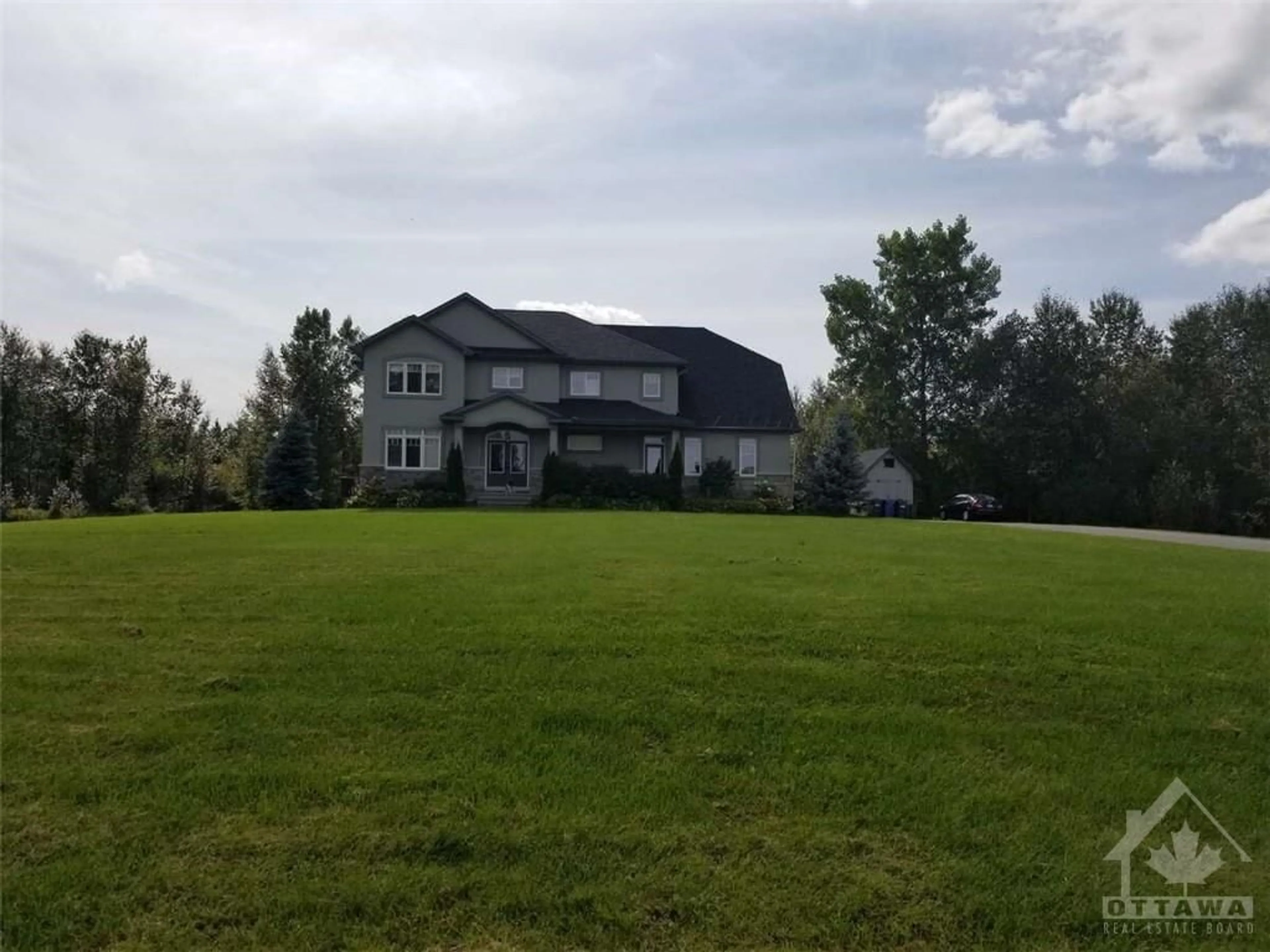 Frontside or backside of a home, the fenced backyard for 151 GENTRY Rd, Ottawa Ontario K0A 1L0