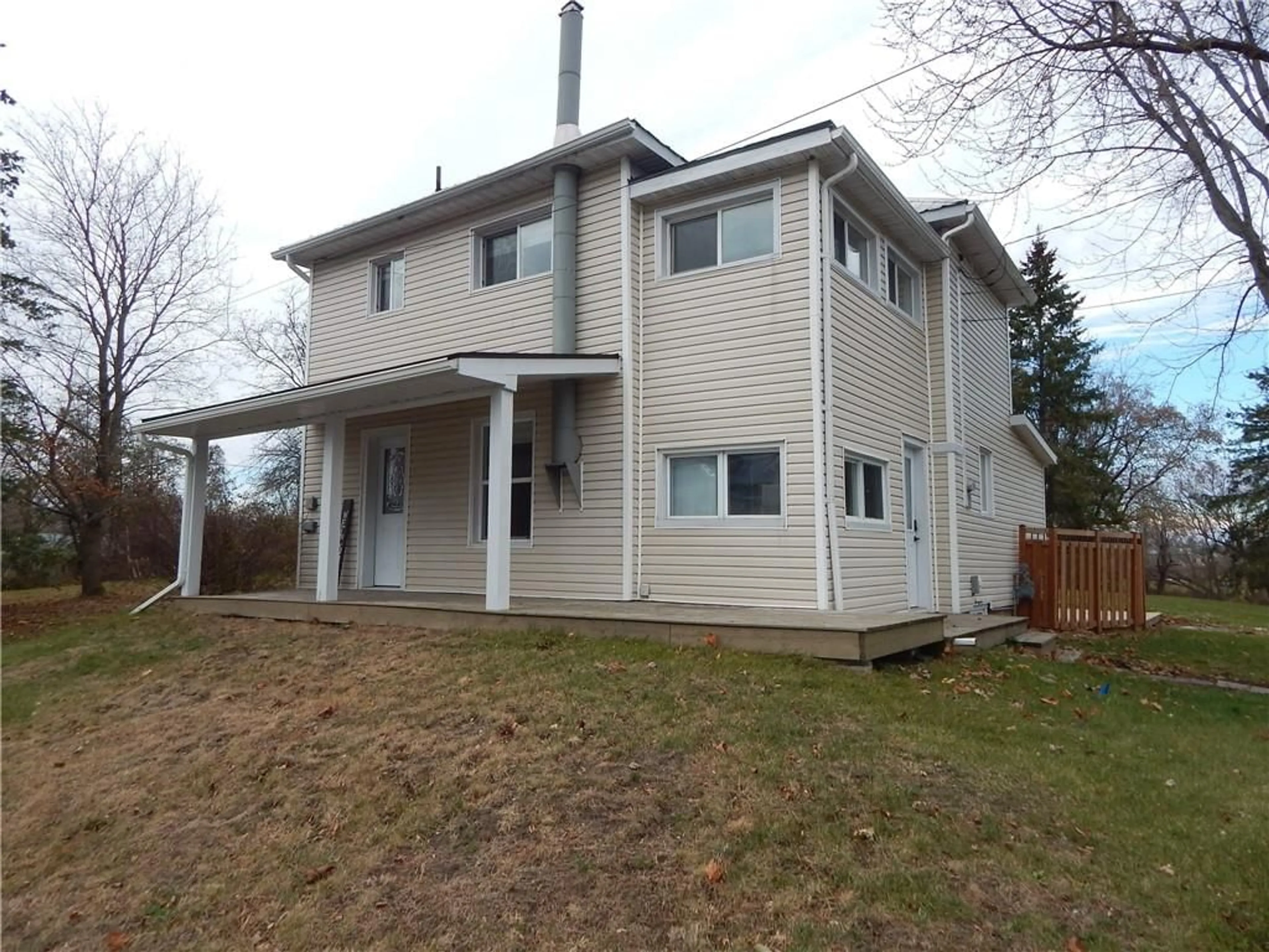 Frontside or backside of a home, the fenced backyard for 17337 COUNTY RD 18 Rd, St Andrews West Ontario K0C 2A0