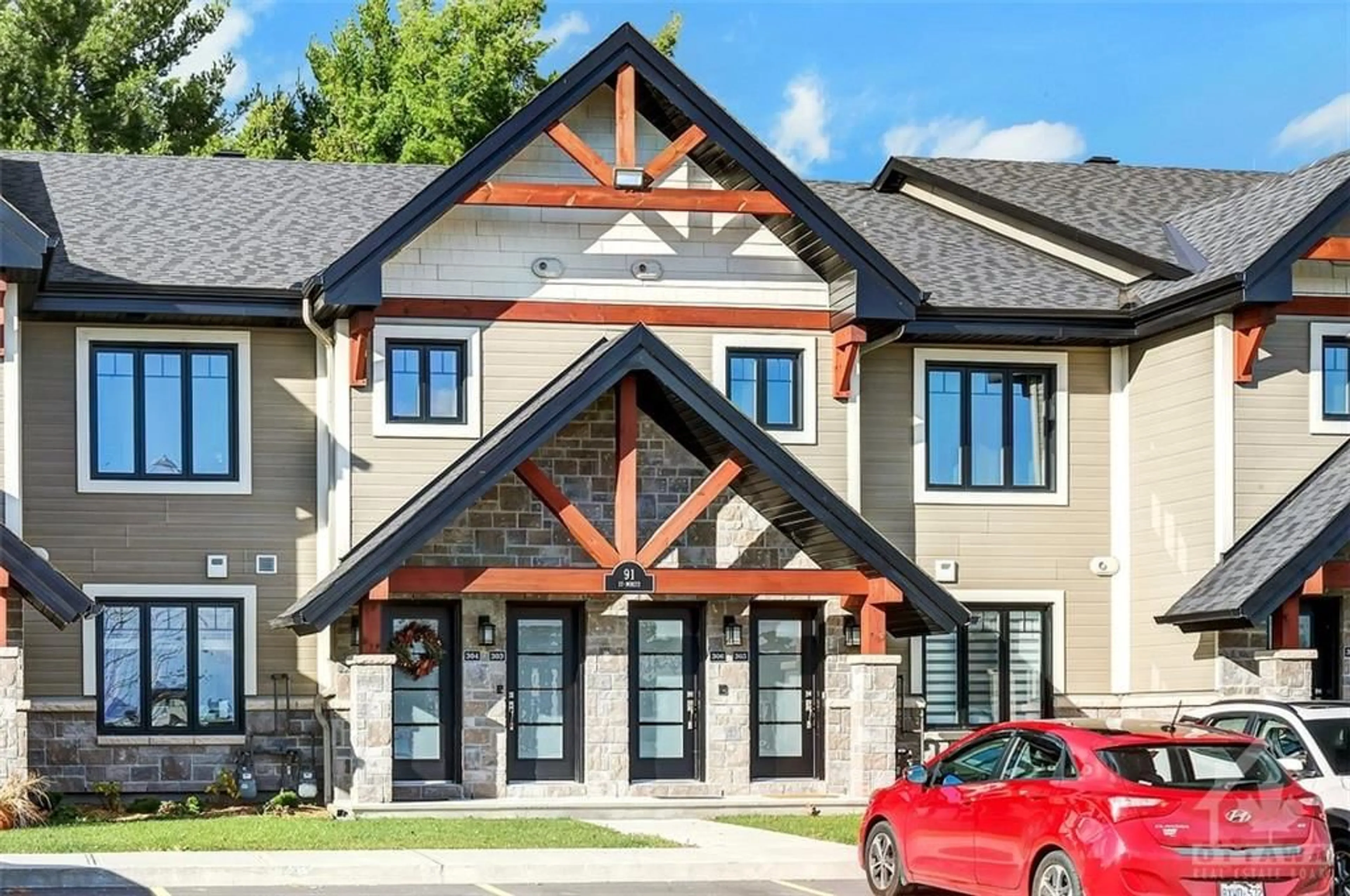 A pic from exterior of the house or condo, the front or back of building for 91 ST MORITZ Trail #305, Embrun Ontario K0A 1W0