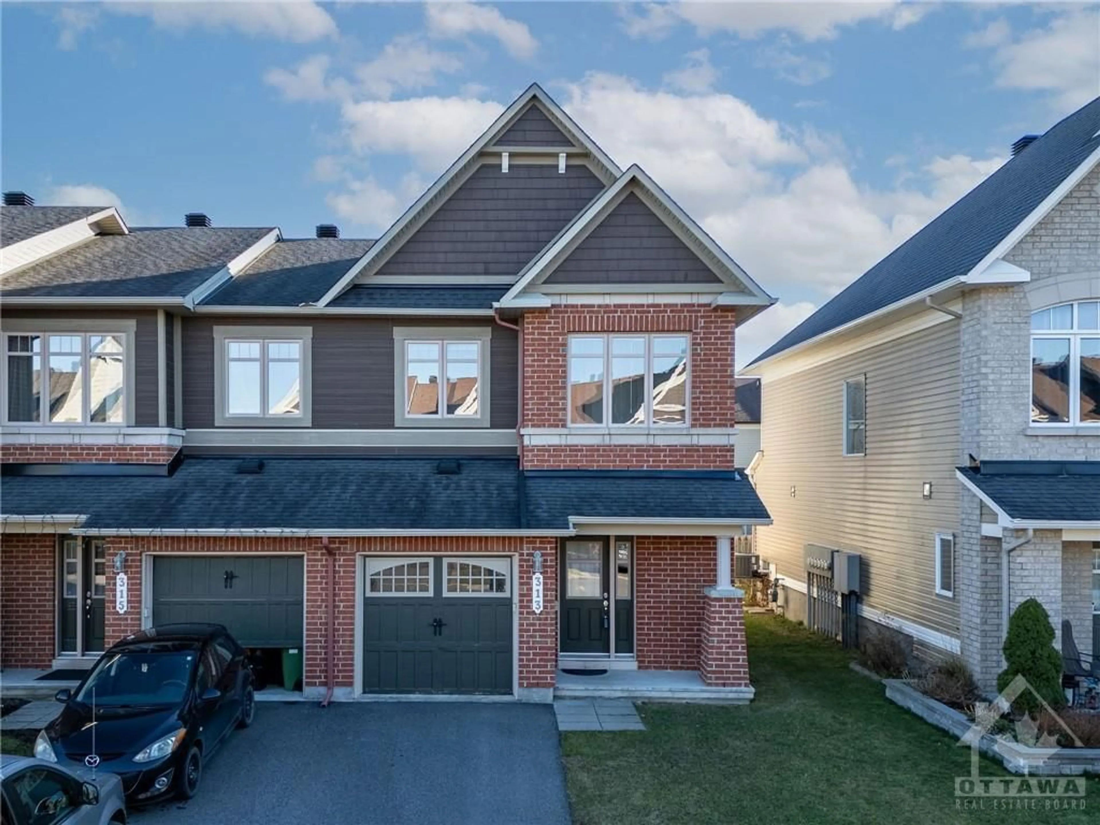 Home with brick exterior material for 313 RAVENSWOOD Way, Ottawa Ontario K4A 0R9