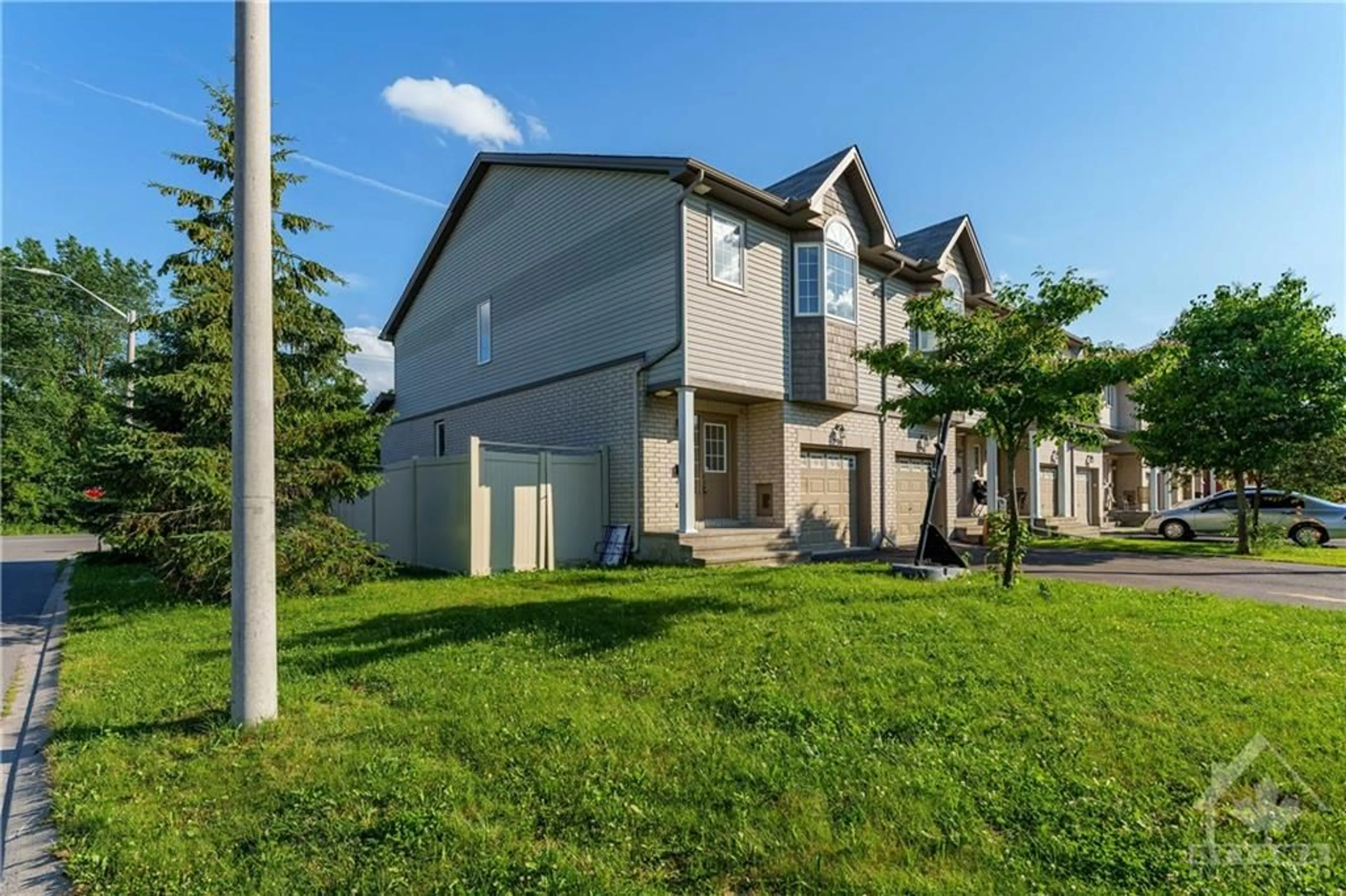 A pic from exterior of the house or condo, the fenced backyard for 298 MACOUN Cir, Ottawa Ontario K1T 0H8