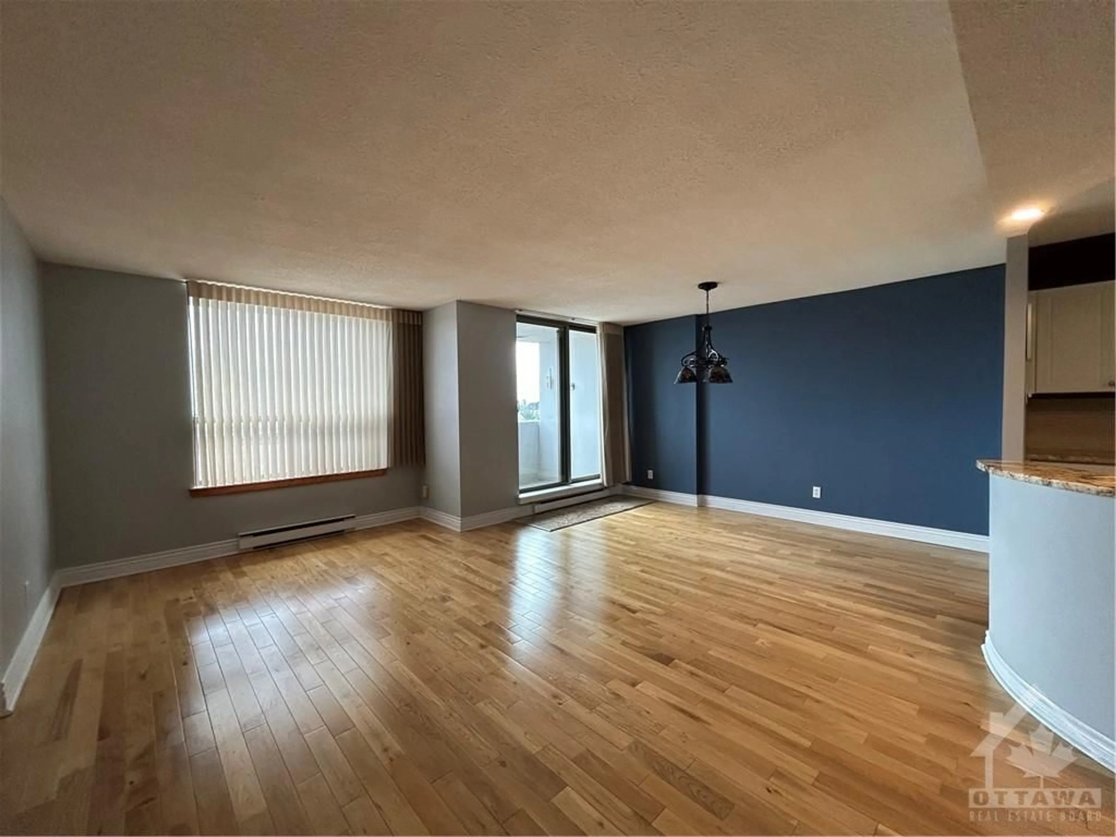 A pic of a room, wood floors for 200 LAFONTAINE Ave #1503, Ottawa Ontario K1L 8K8