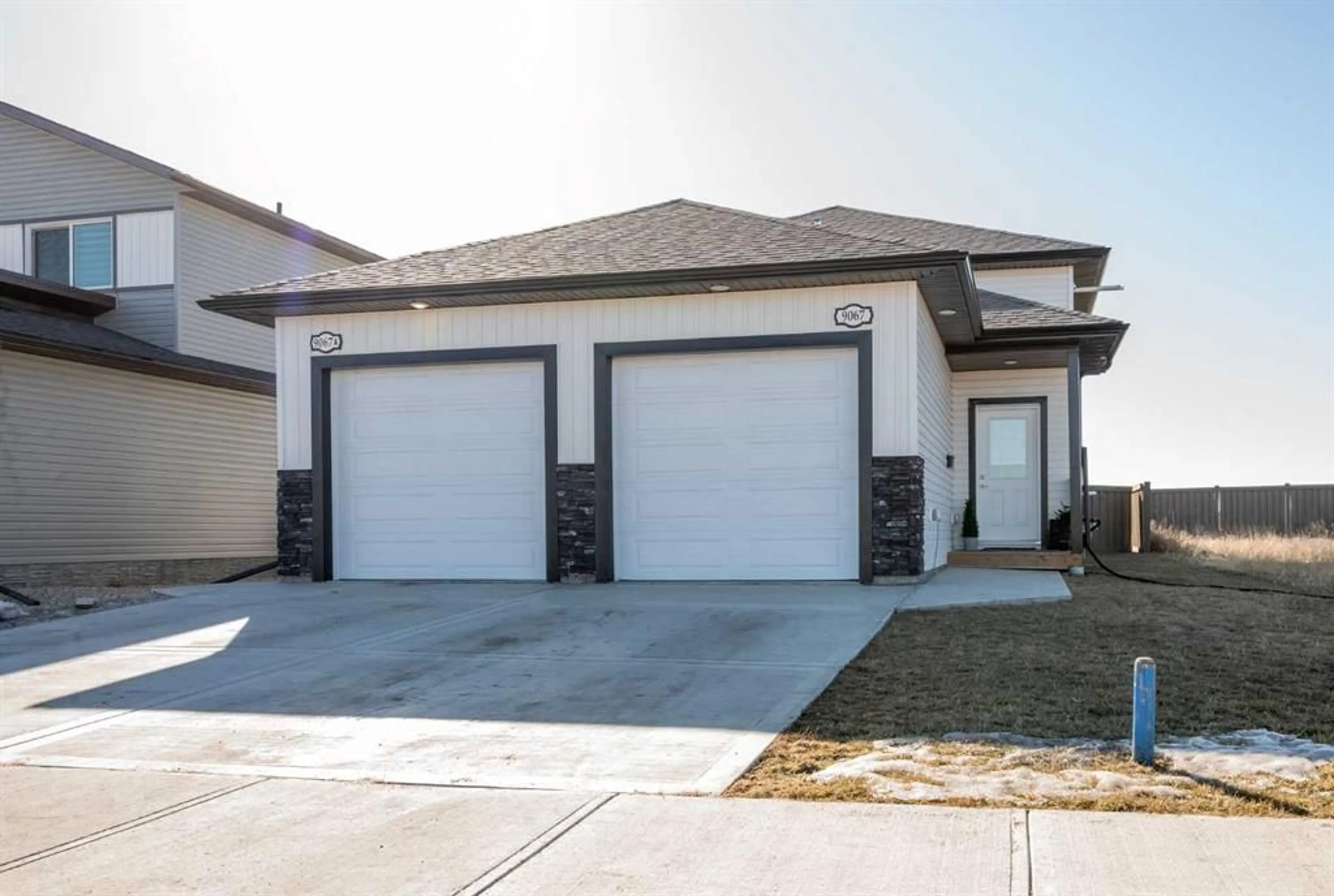 Frontside or backside of a home for 9067 80 Ave, Grande Prairie Alberta T8X0W3