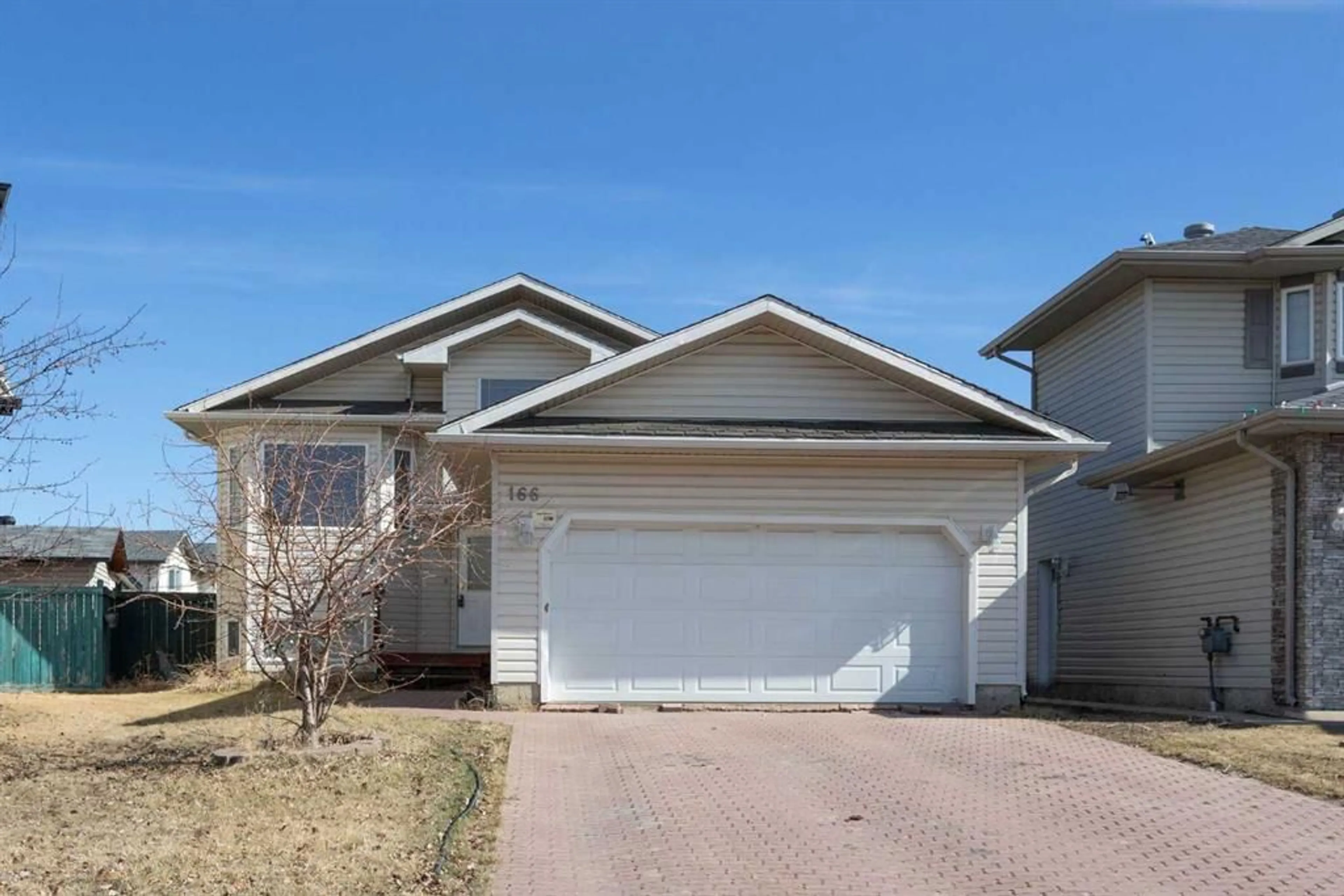 Frontside or backside of a home for 166 Smallwood St, Fort McMurray Alberta T9K 2J7