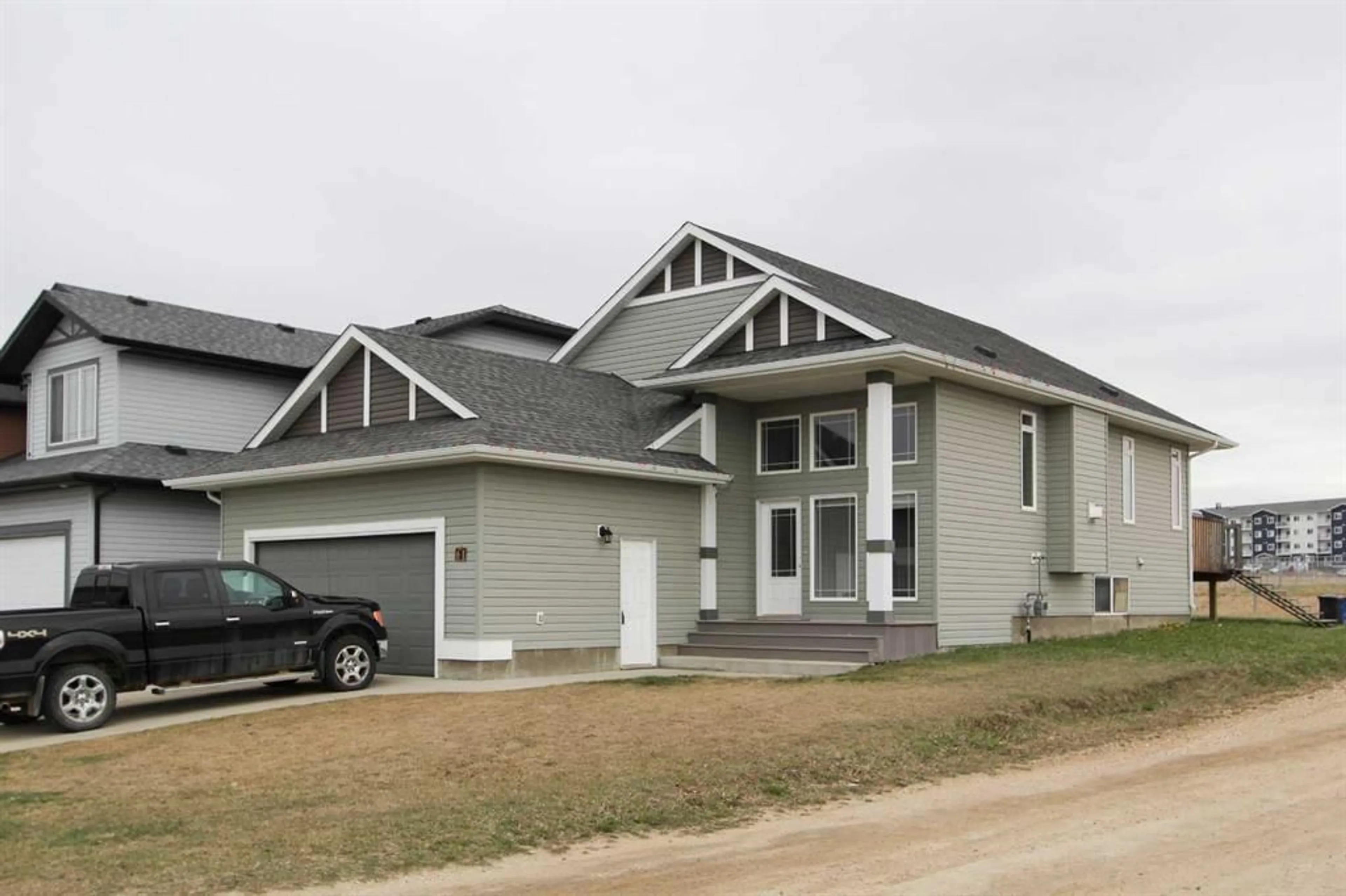 Frontside or backside of a home for 61 Bowman Cir, Sylvan Lake Alberta T4S 0H9