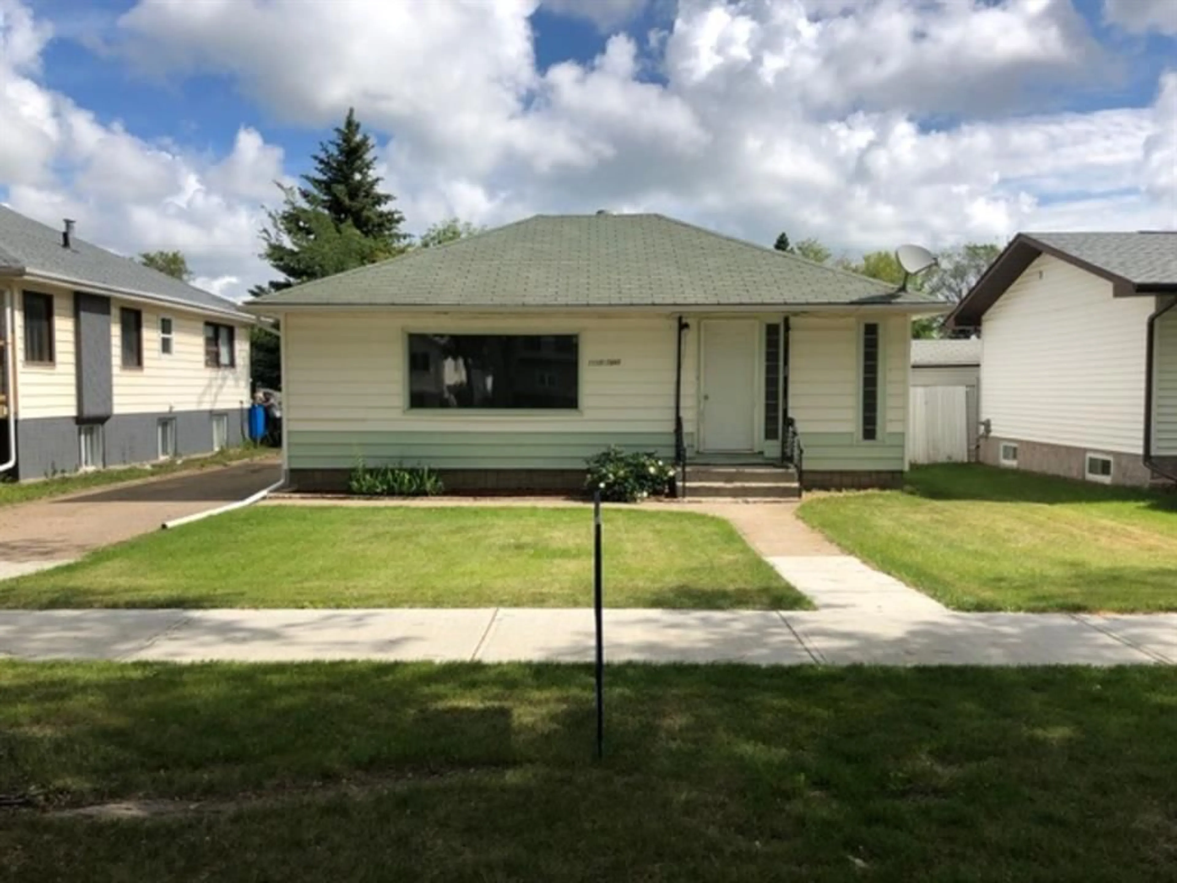 Frontside or backside of a home for 1110 2 Ave, Wainwright Alberta T9W 1T9