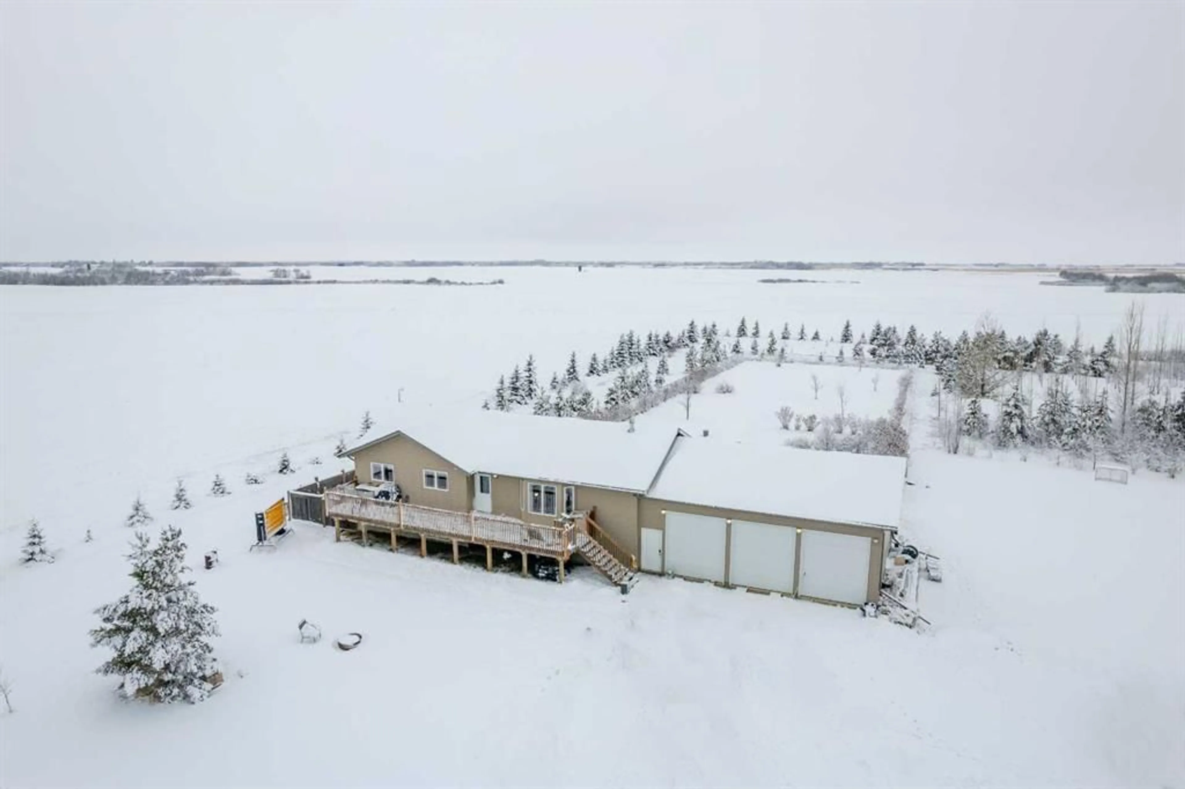 A pic from outside/outdoor area/front of a property/back of a property/a pic from drone, building for 1-51076 RGE RD  NE 5-51-27-W3rd, Rural Saskatchewan S9V 0Y2