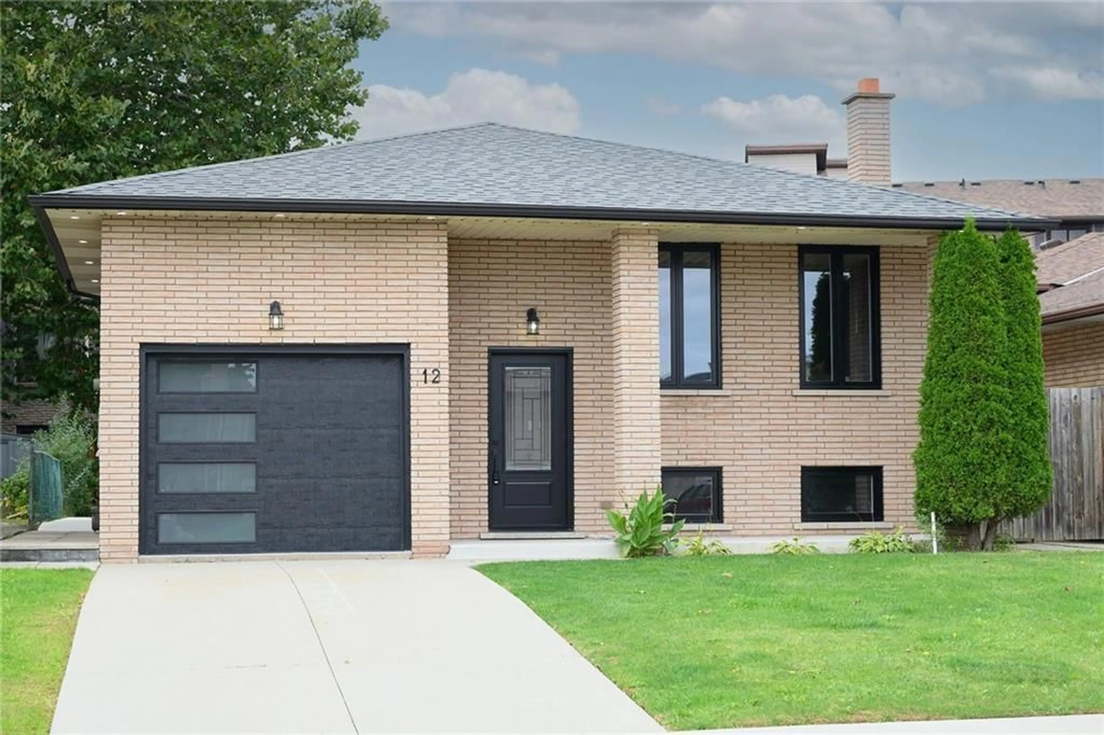 Home with brick exterior material for 12 SOLOMON Cres, Hamilton Ontario L8W 1Y7