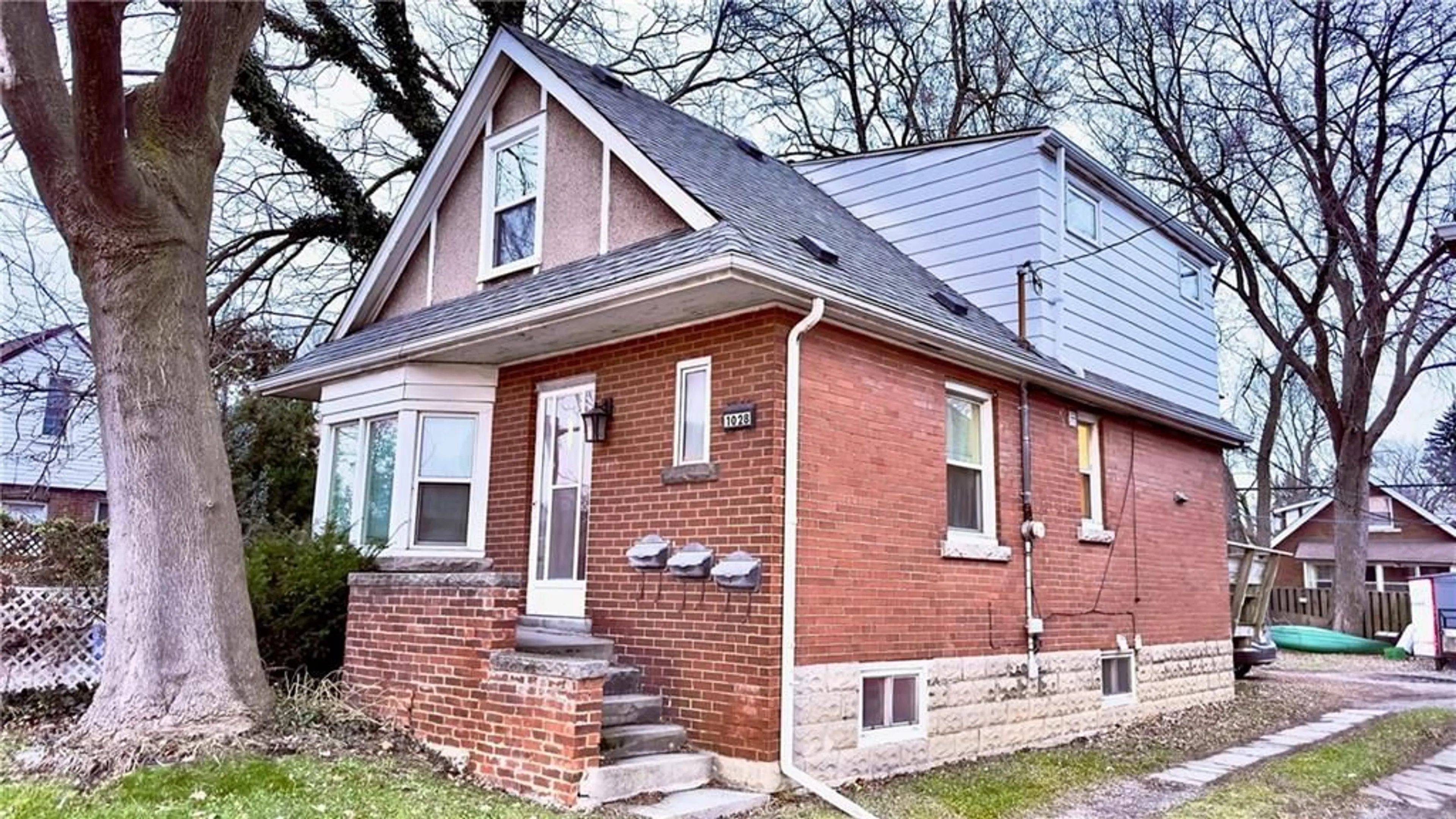 Home with brick exterior material for 1028 Main St, Hamilton Ontario L8S 1B2