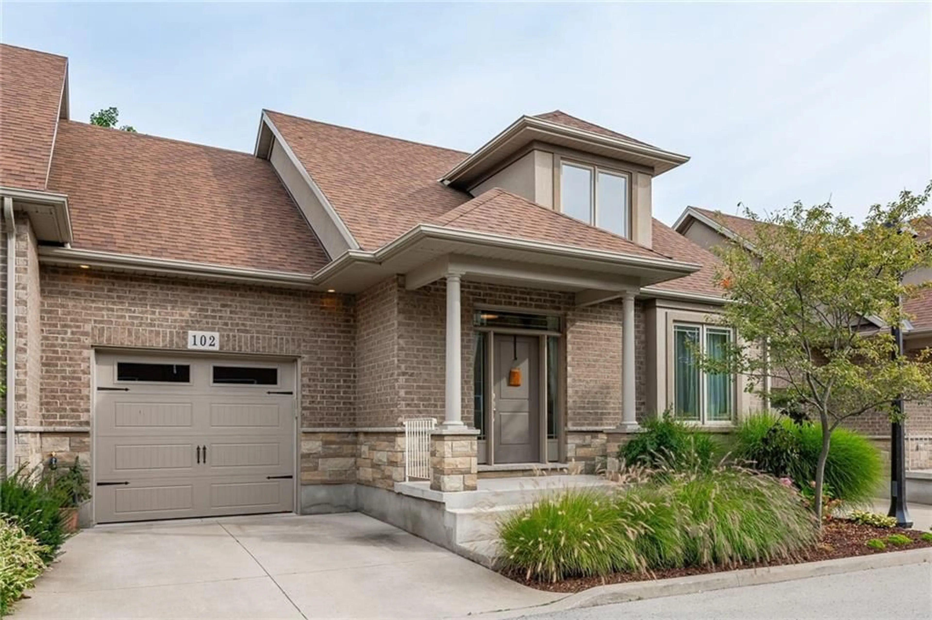 Home with brick exterior material for 6186 DORCHESTER Rd #102, Niagara Falls Ontario L2G 5T2