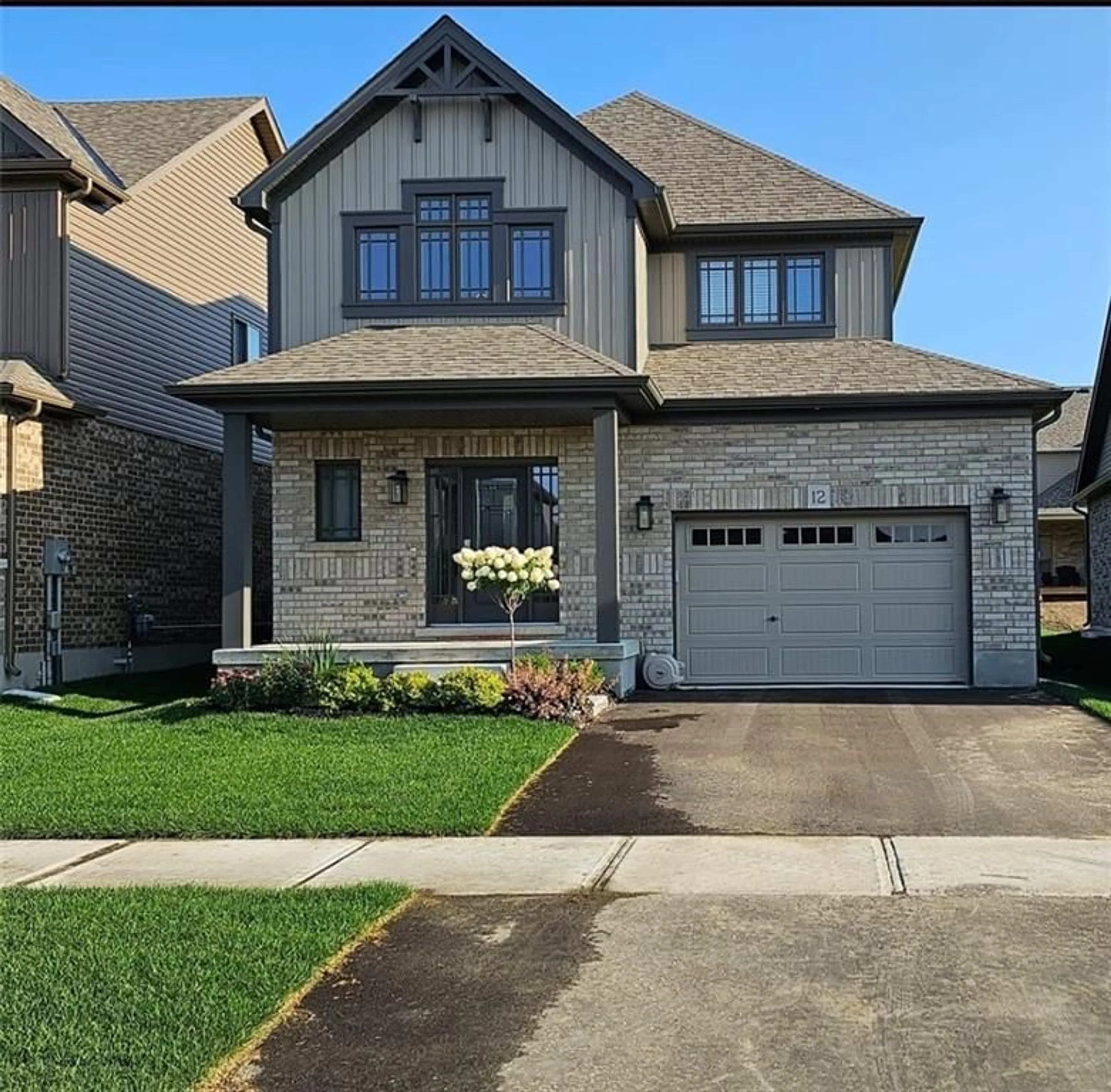 Frontside or backside of a home for 12 Mitchell Ave, Collingwood Ontario L9Y 5M3