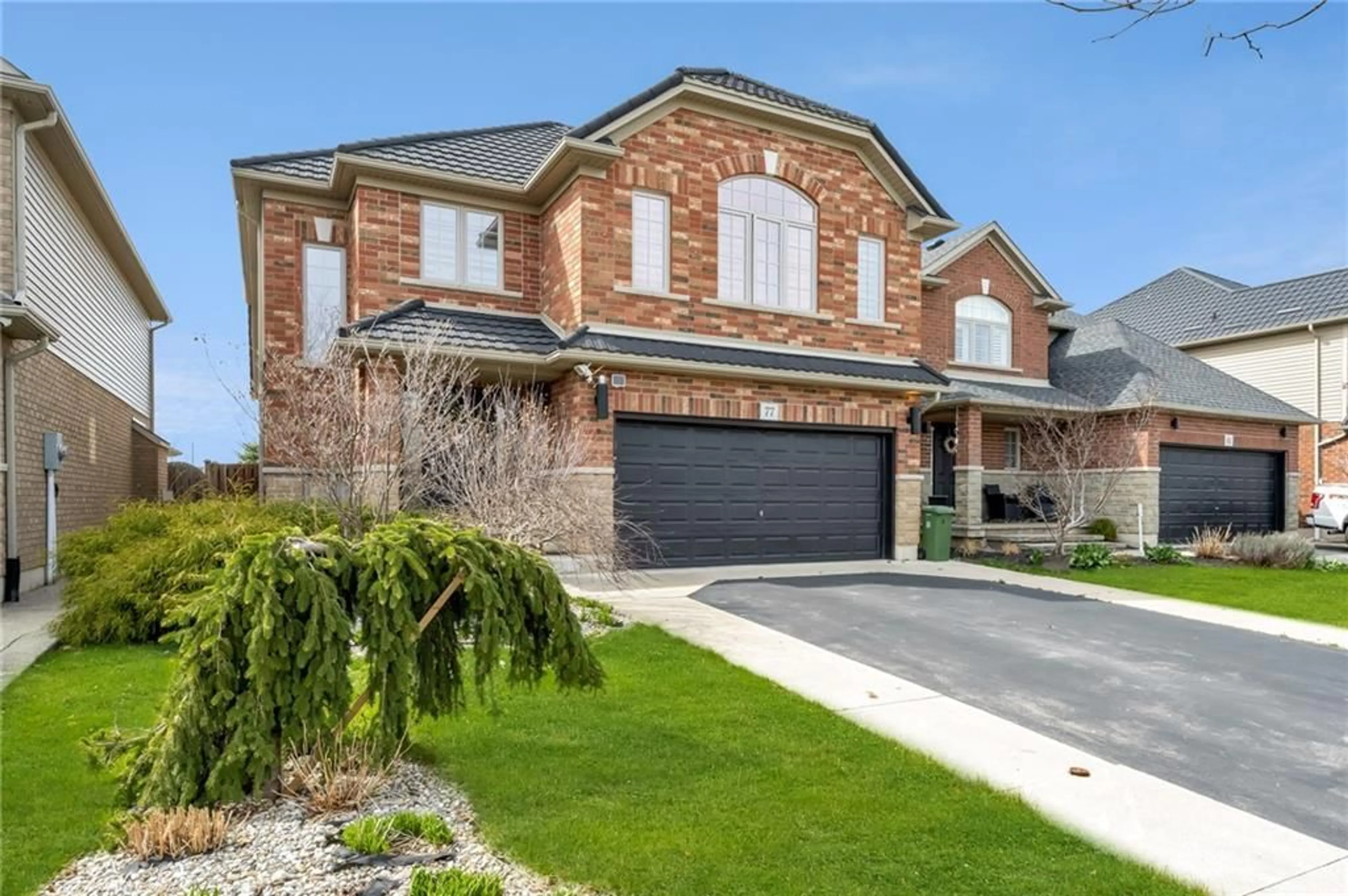 Home with brick exterior material for 77 Tanglewood Dr, Binbrook Ontario L0R 1C0