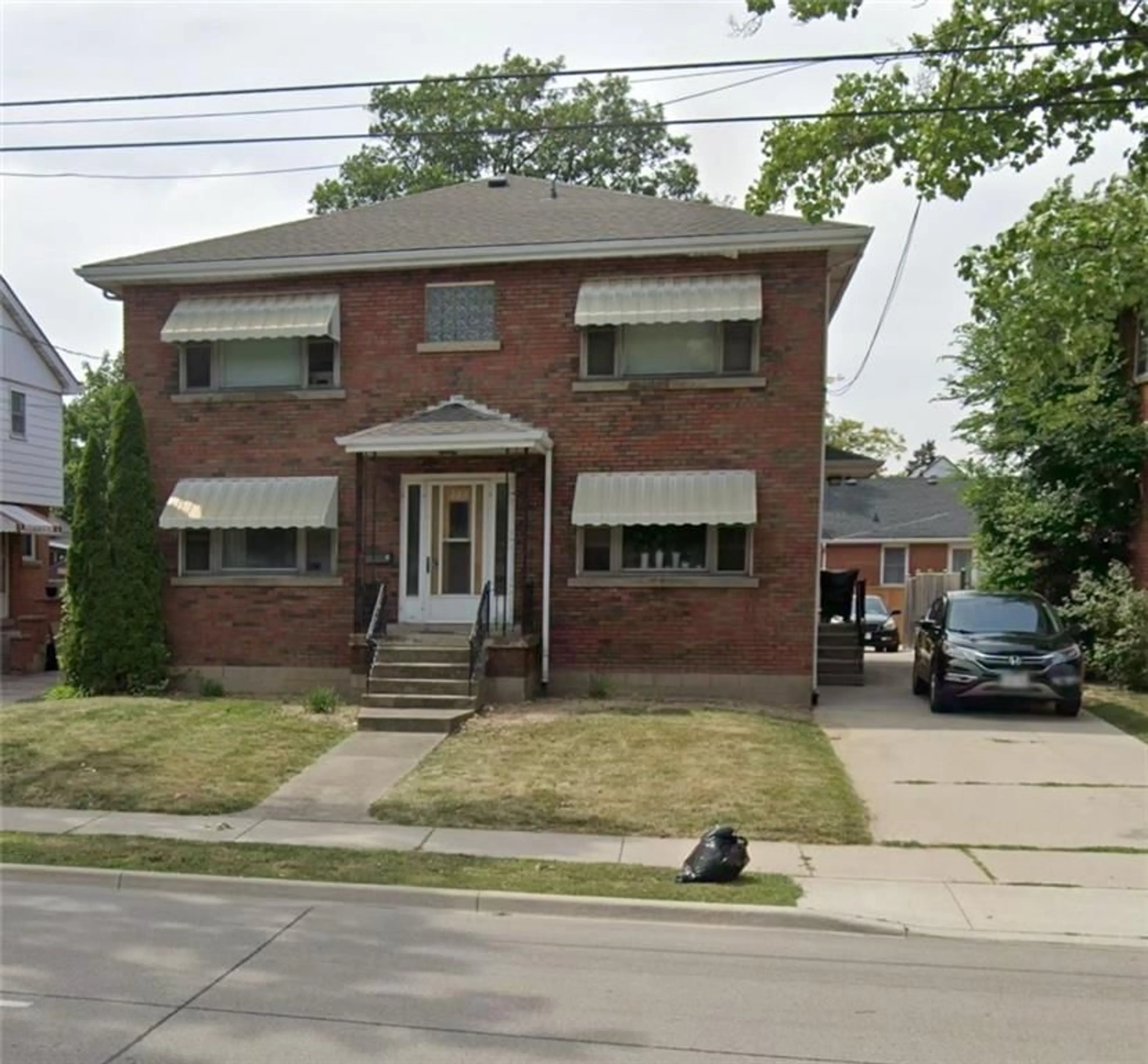 Frontside or backside of a home for 348 UPPER OTTAWA St, Hamilton Ontario L8T 3S7