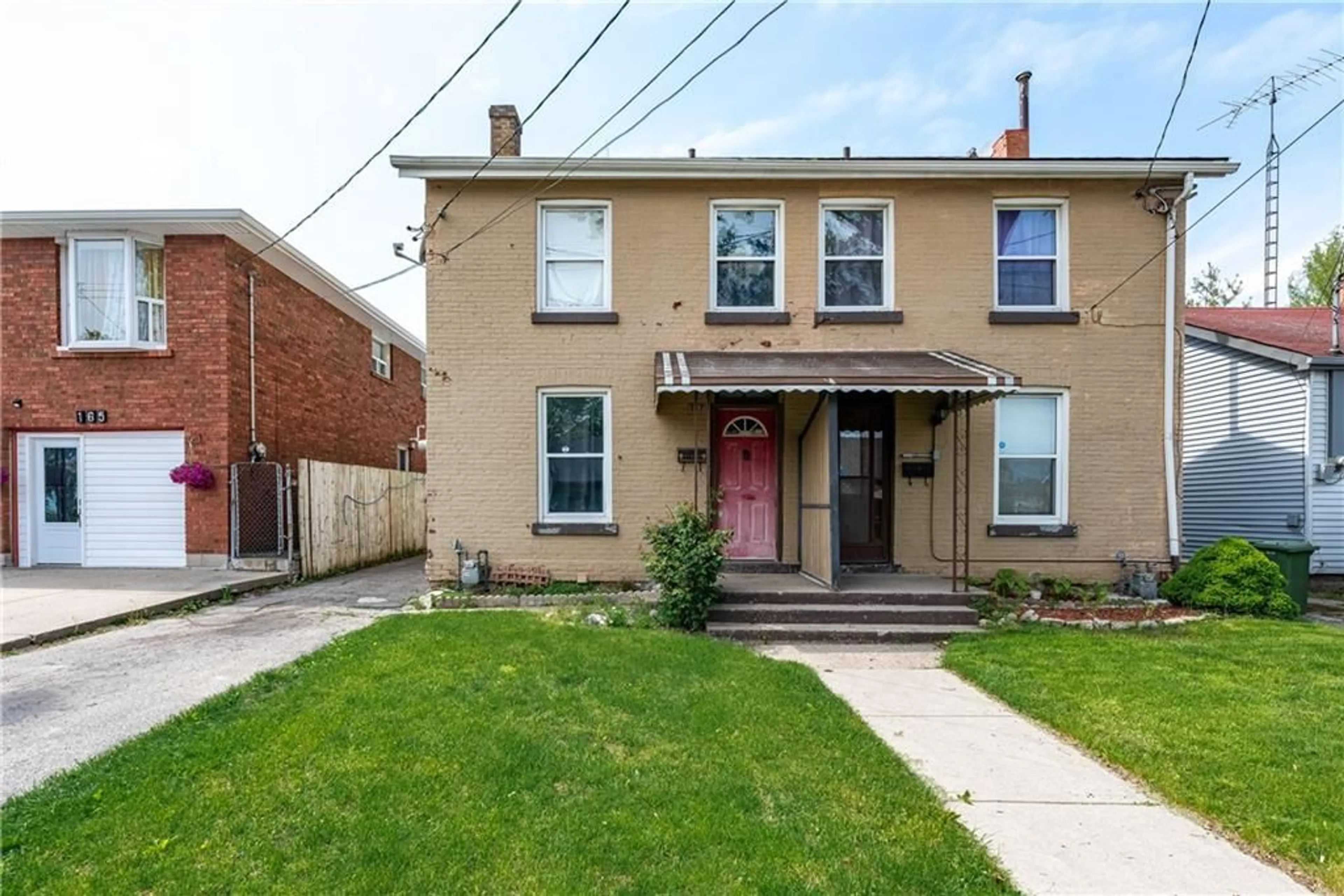 Frontside or backside of a home for 167 Locke St, Hamilton Ontario L8R 3B1