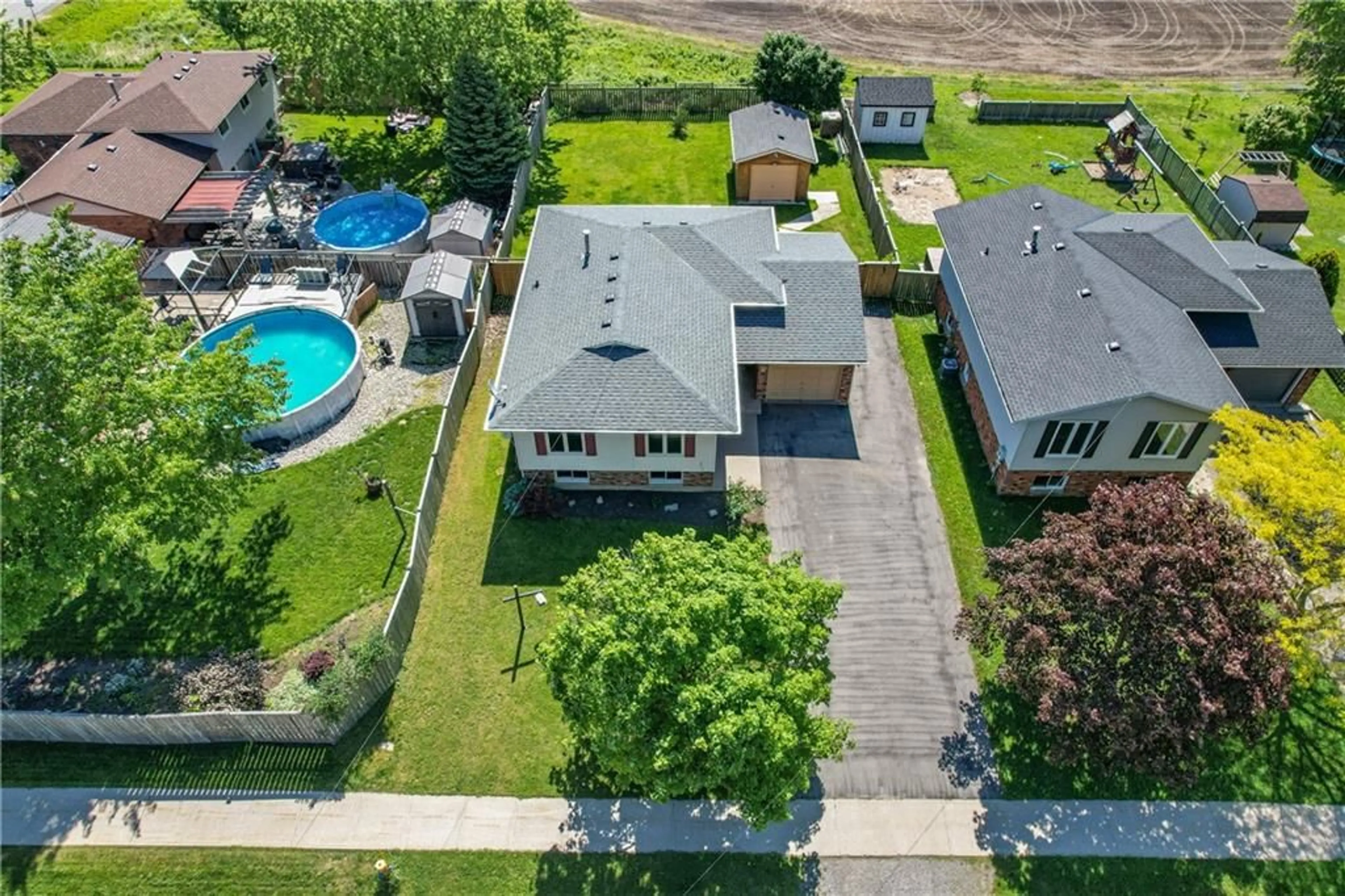 Frontside or backside of a home, the fenced backyard for 368 STATION St, West Lincoln Ontario L0R 2A0