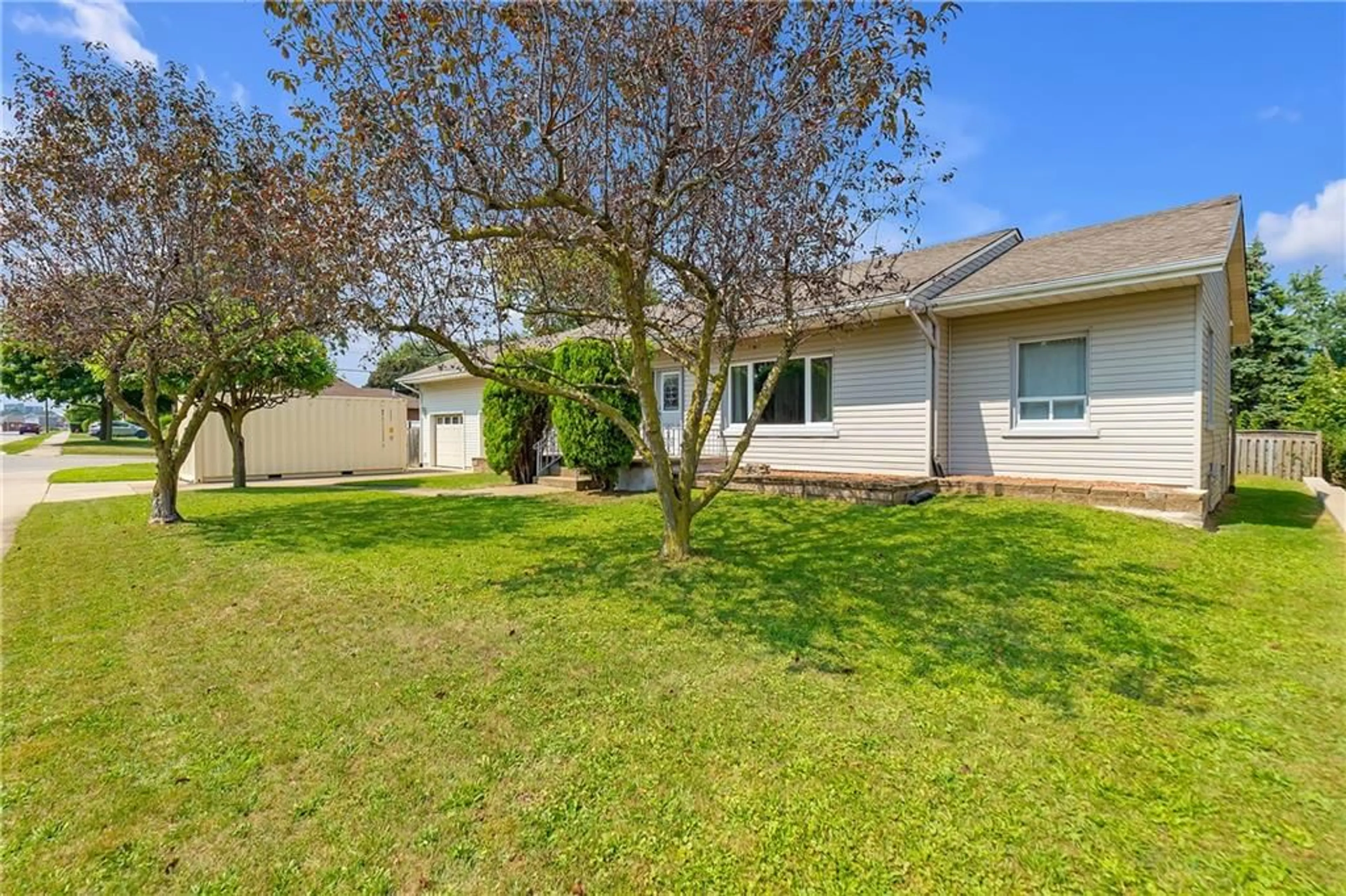 Frontside or backside of a home, the fenced backyard for 183 Federal St, Stoney Creek Ontario L8E 1N8