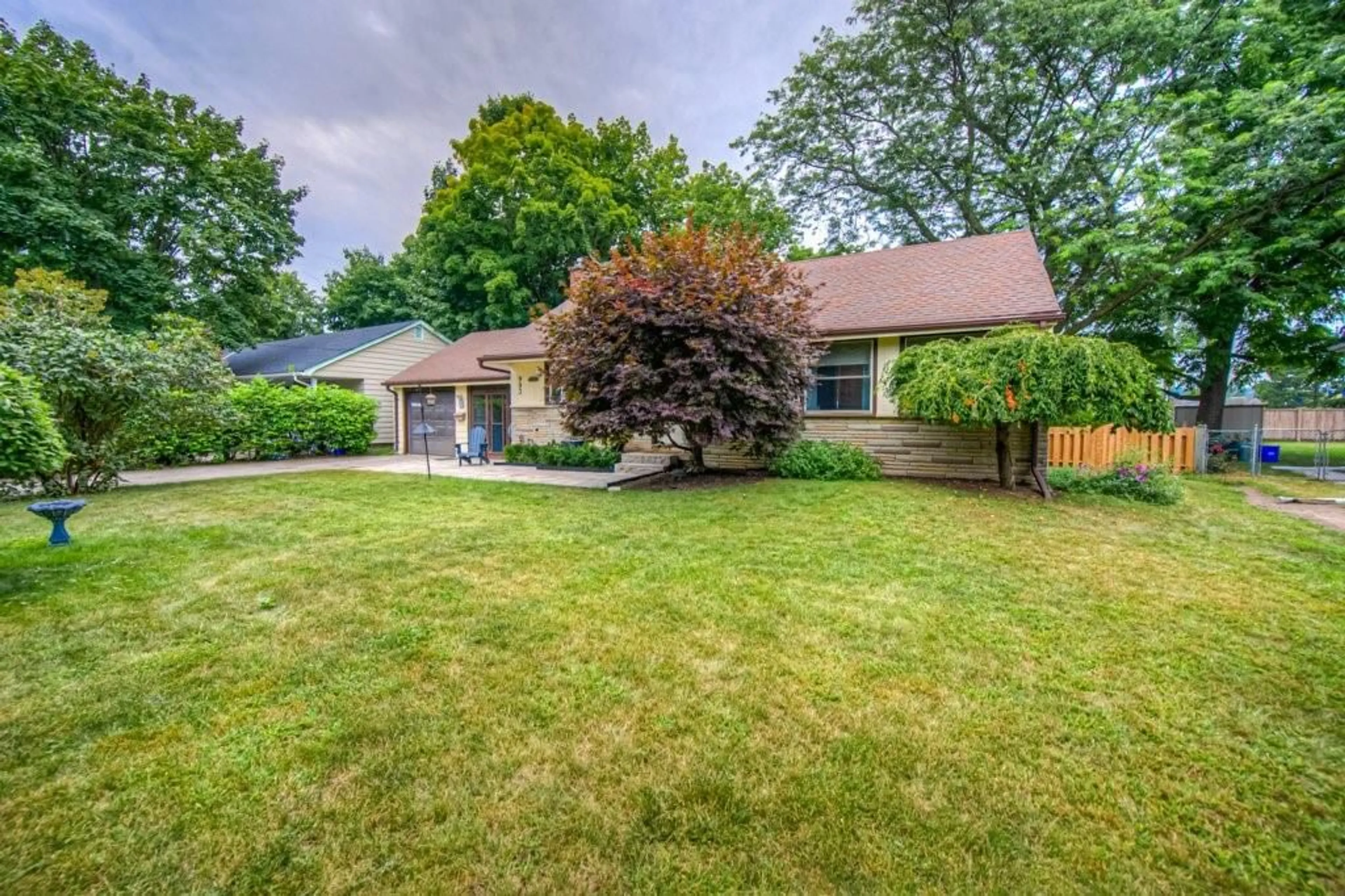 Frontside or backside of a home, the fenced backyard for 993 CLOVERLEAF Dr, Burlington Ontario L7T 3Y8