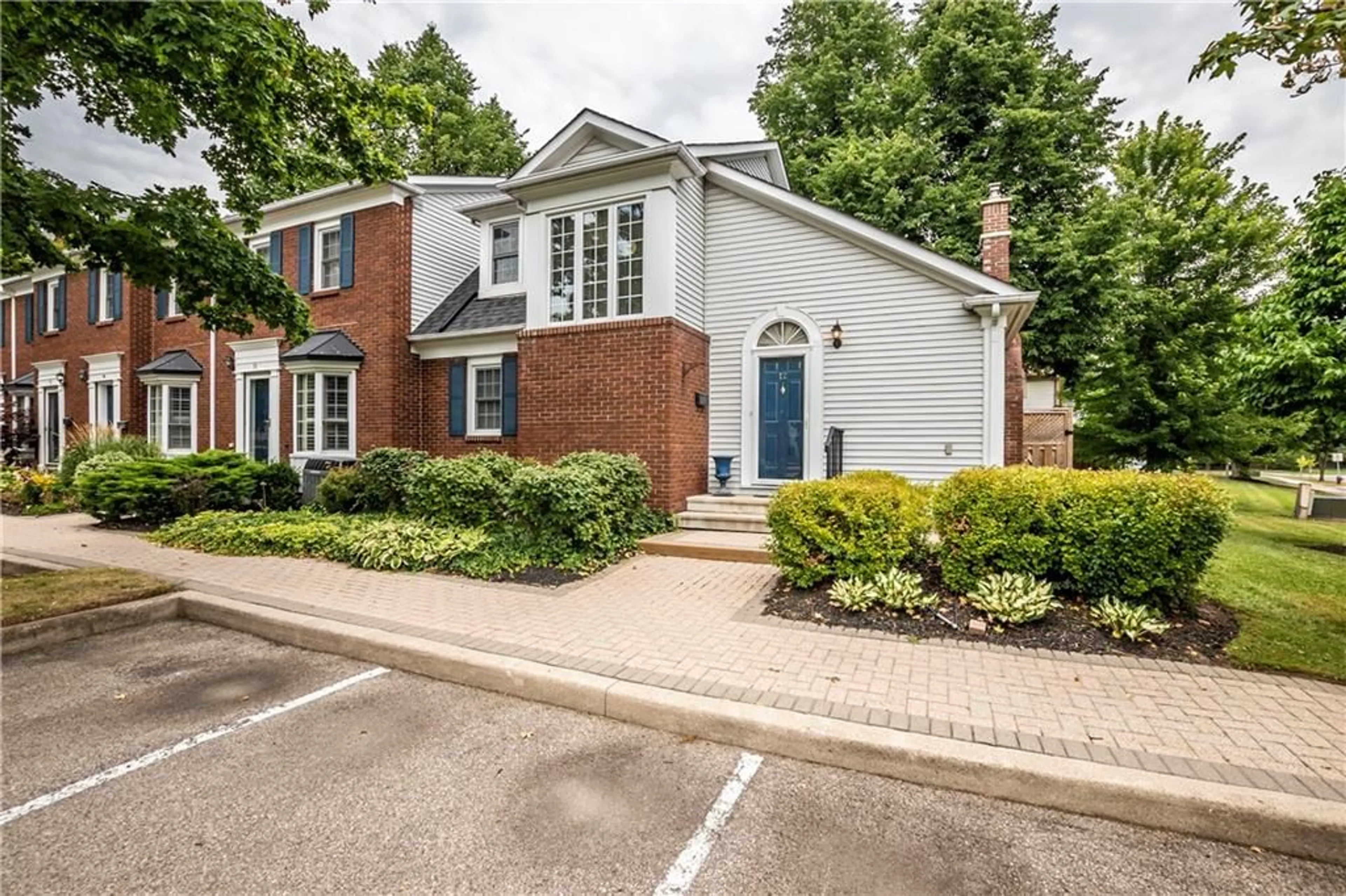 A pic from exterior of the house or condo, the street view for 1275 MAPLE CROSSING Blvd #12, Burlington Ontario L7S 2E8