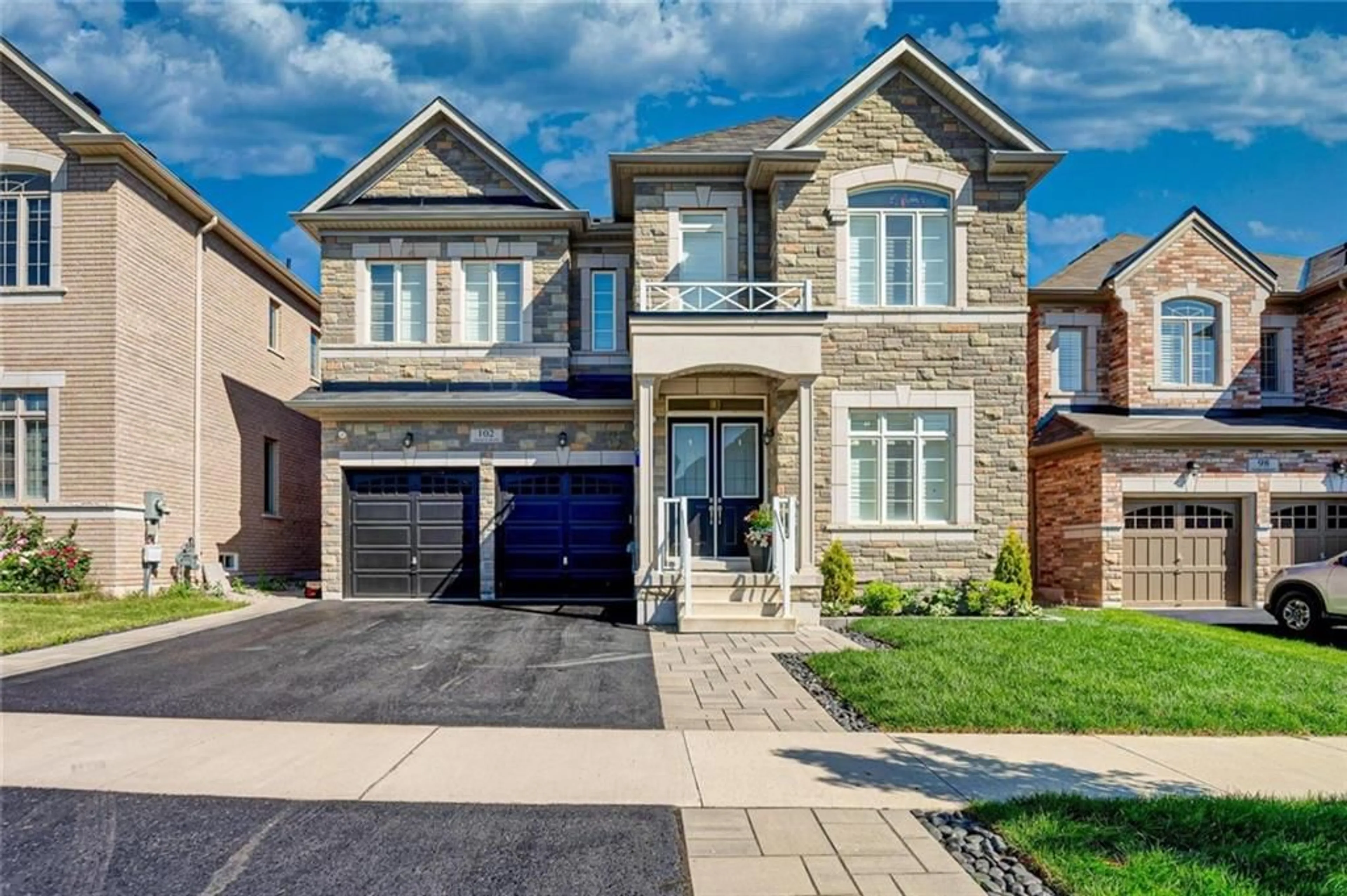 Home with brick exterior material for 102 AVANTI Cres, Waterdown Ontario L8B 1W8