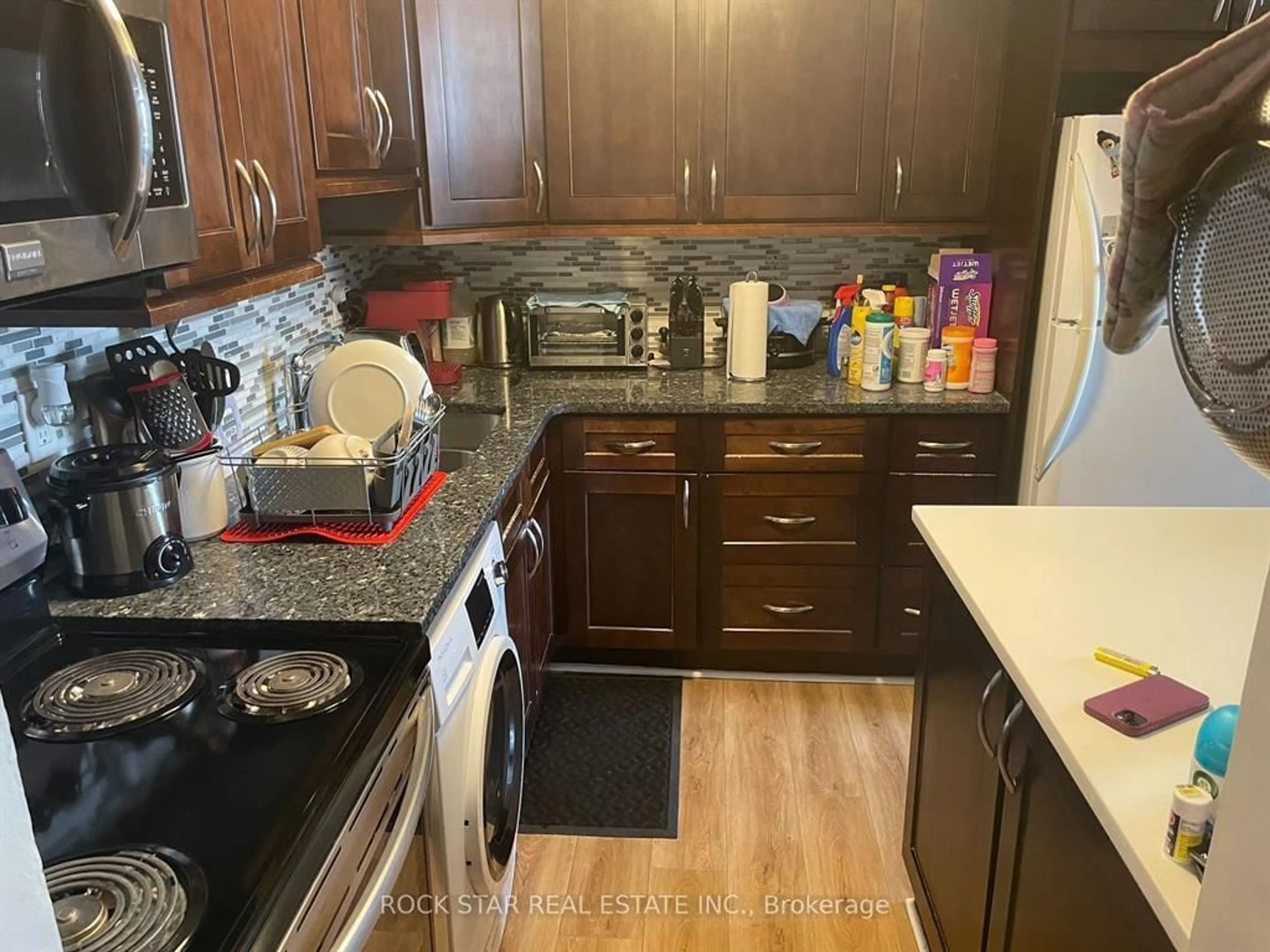 Kitchen with laundary machines for 15 ALBRIGHT Rd #602, Hamilton Ontario L8K 5J2