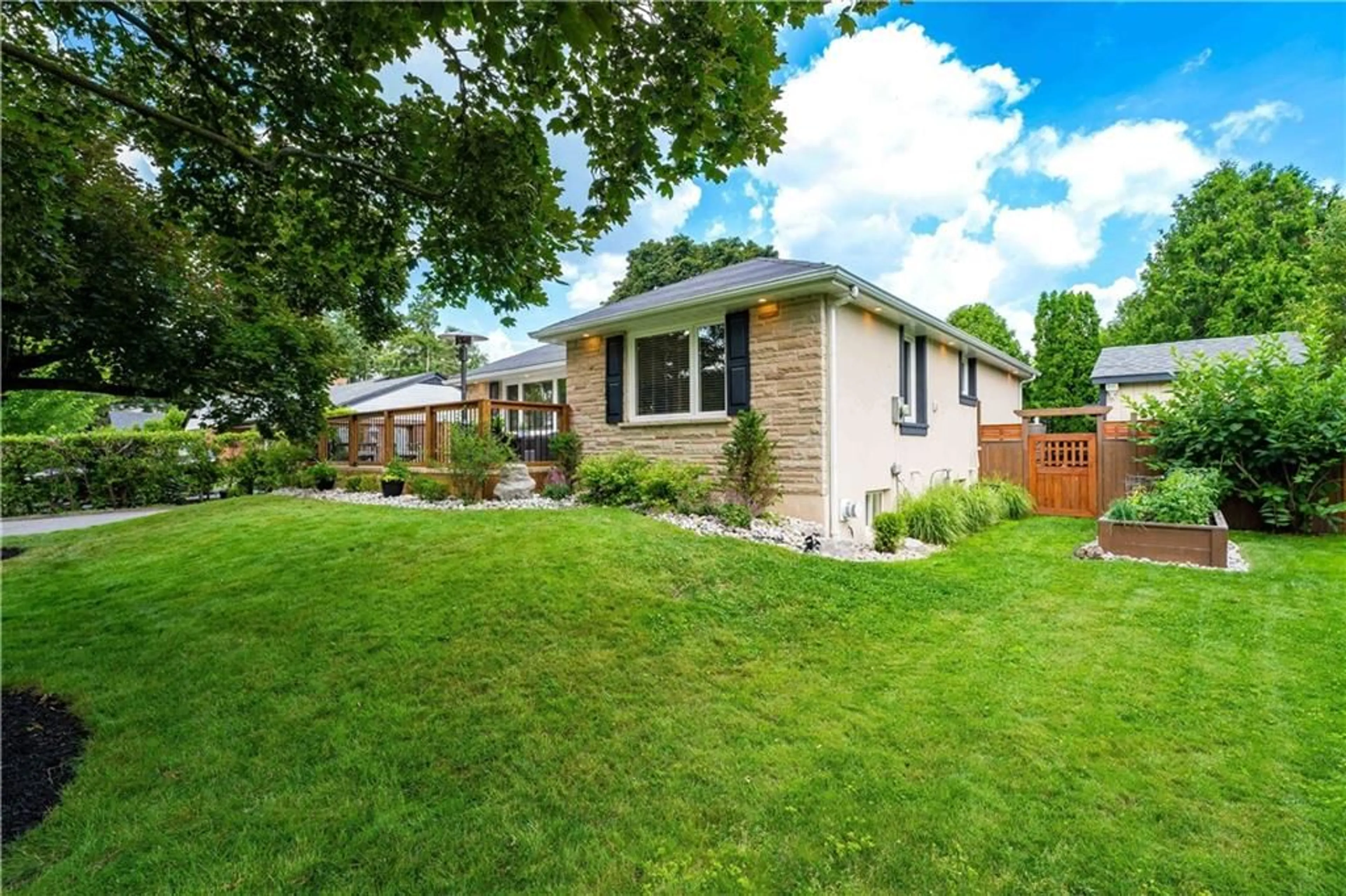 Frontside or backside of a home, the fenced backyard for 947 EASTERBROOK Ave, Burlington Ontario L7T 1P9