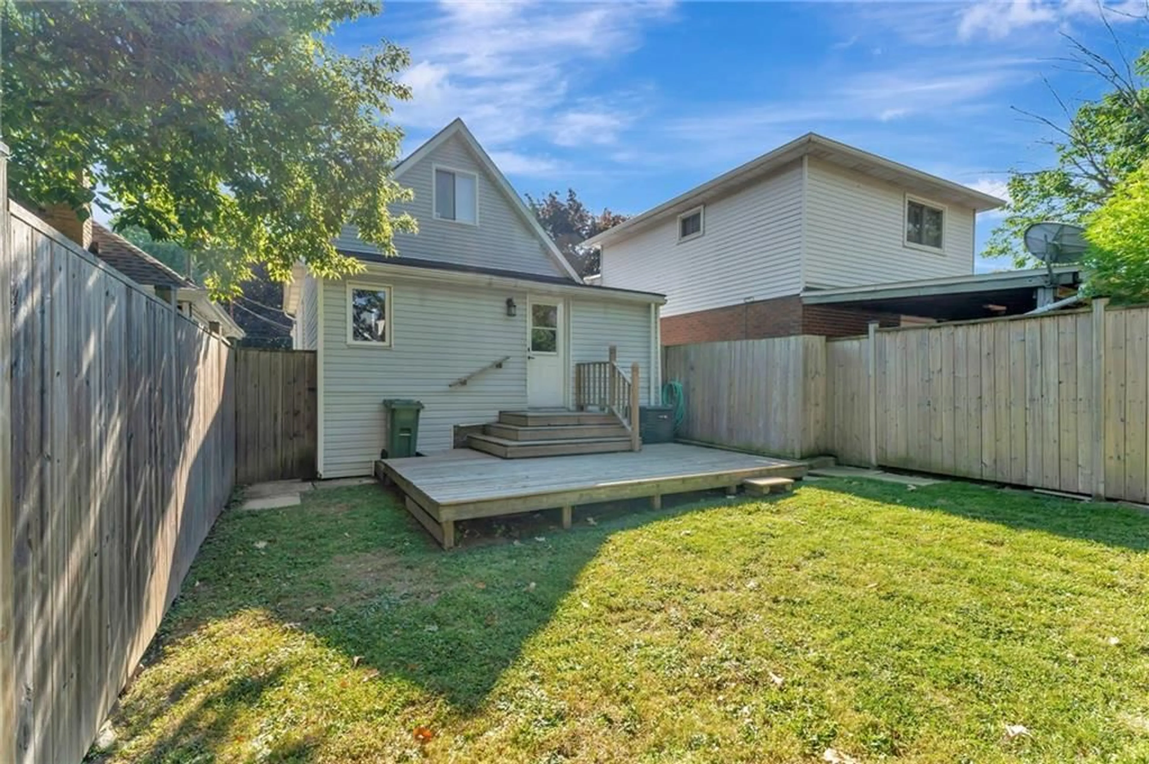 Frontside or backside of a home, the fenced backyard for 82 EAST 35TH St, Hamilton Ontario L8V 3Y1