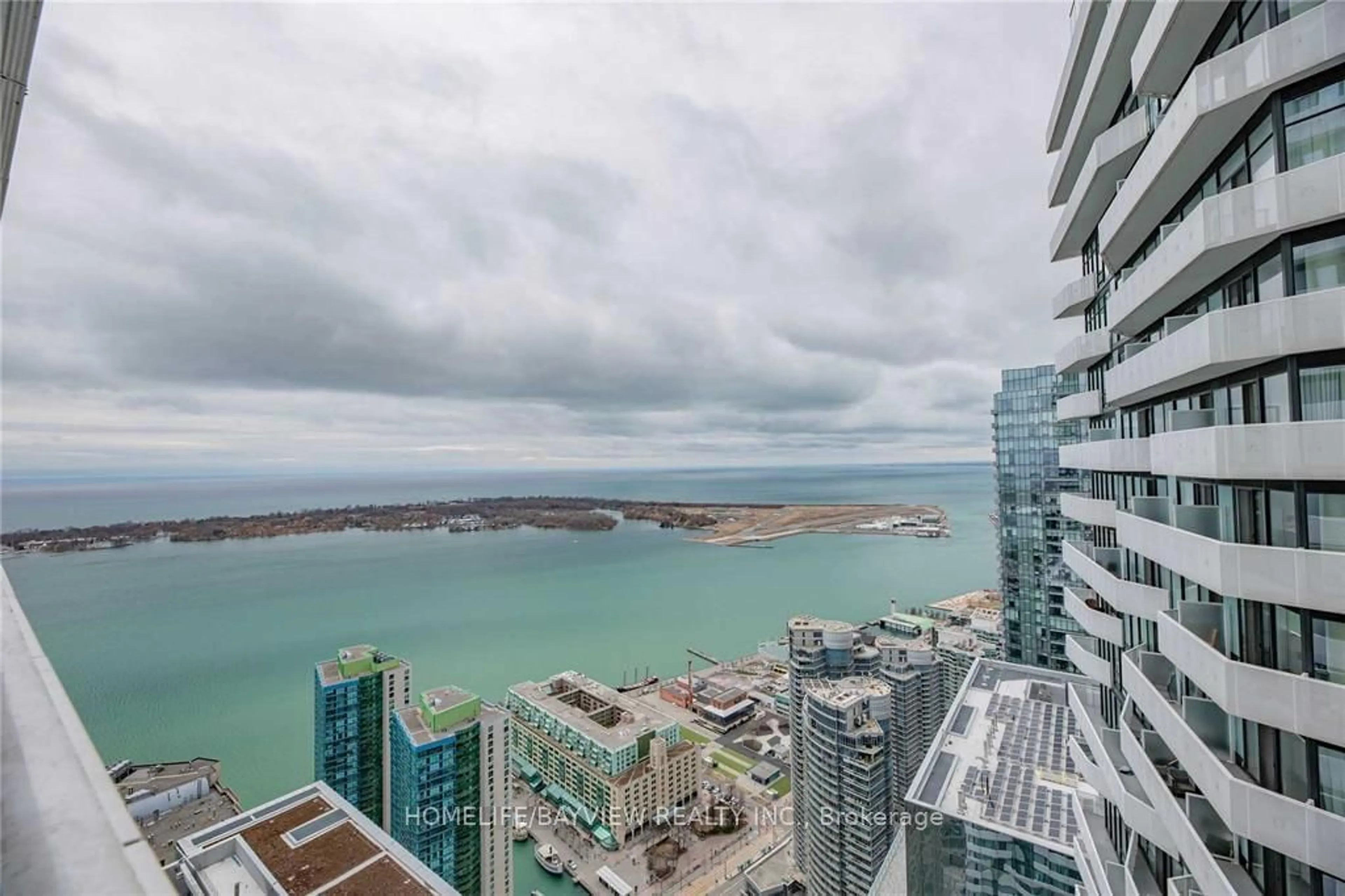 A pic from exterior of the house or condo, the view of city buildings for 88 Harbour St #6601, Toronto Ontario M5J 0C3