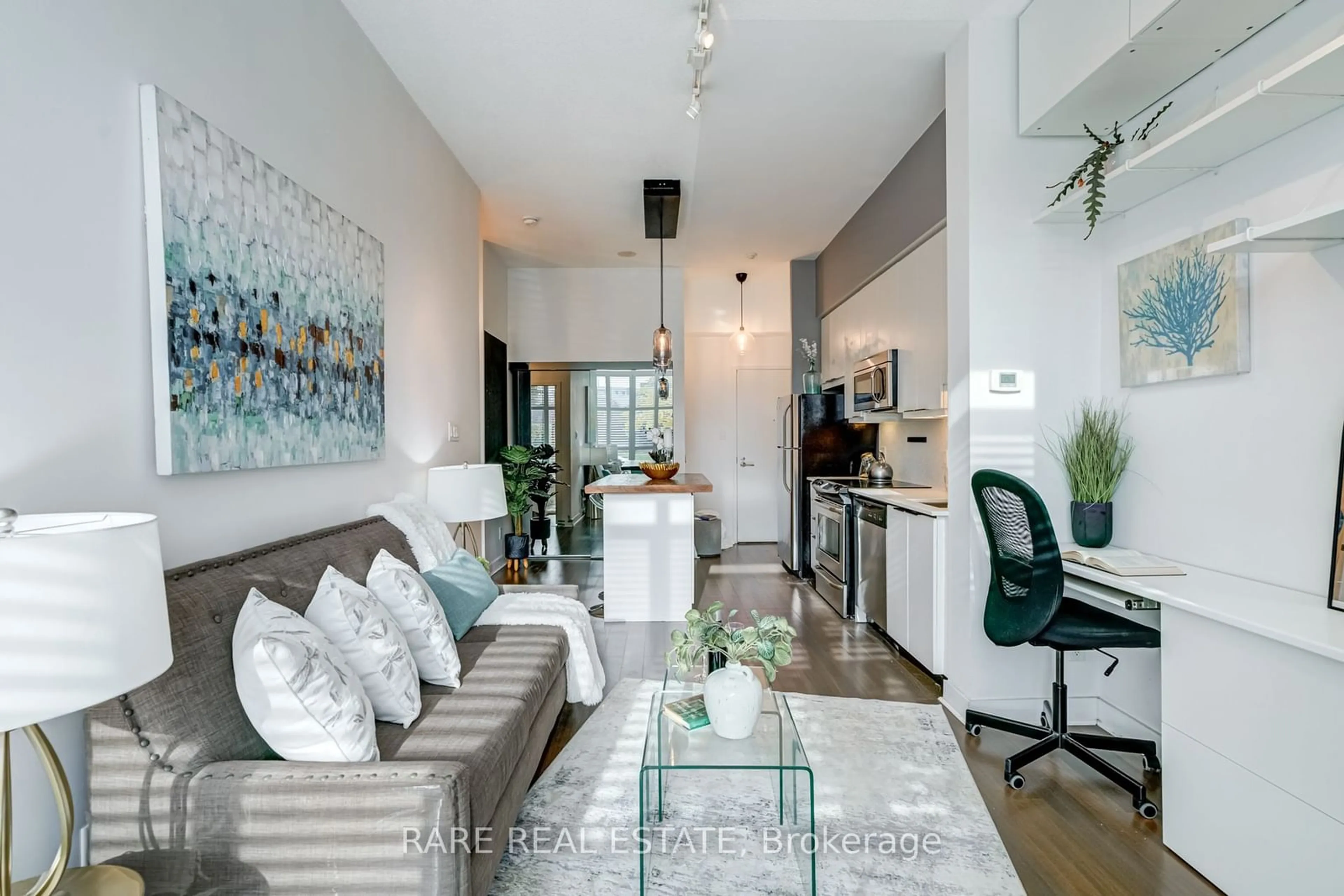 Living room, wood floors for 1171 Queen St #213, Toronto Ontario M6J 1J4