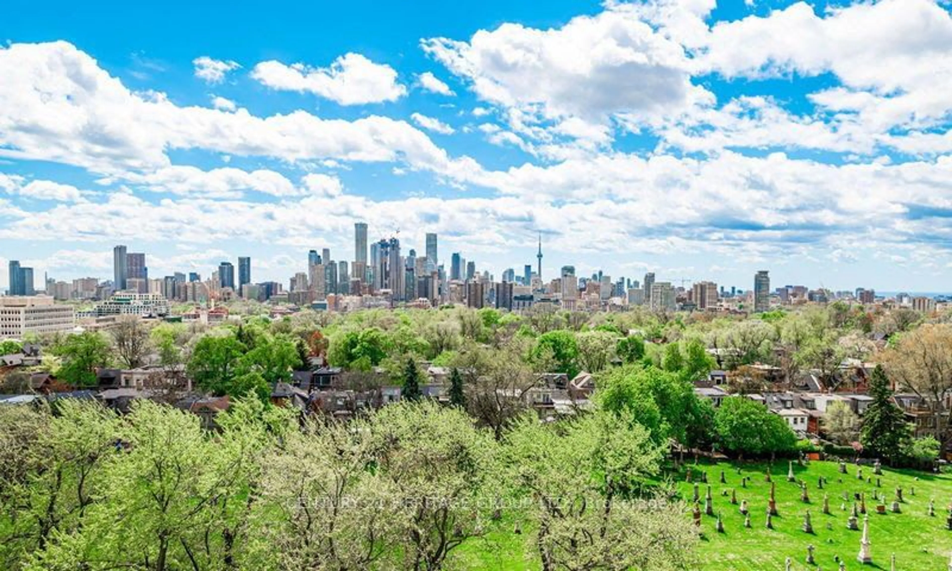 A pic from exterior of the house or condo, the view of city buildings for 63 St Clair Ave #107, Toronto Ontario M4V 2Y9