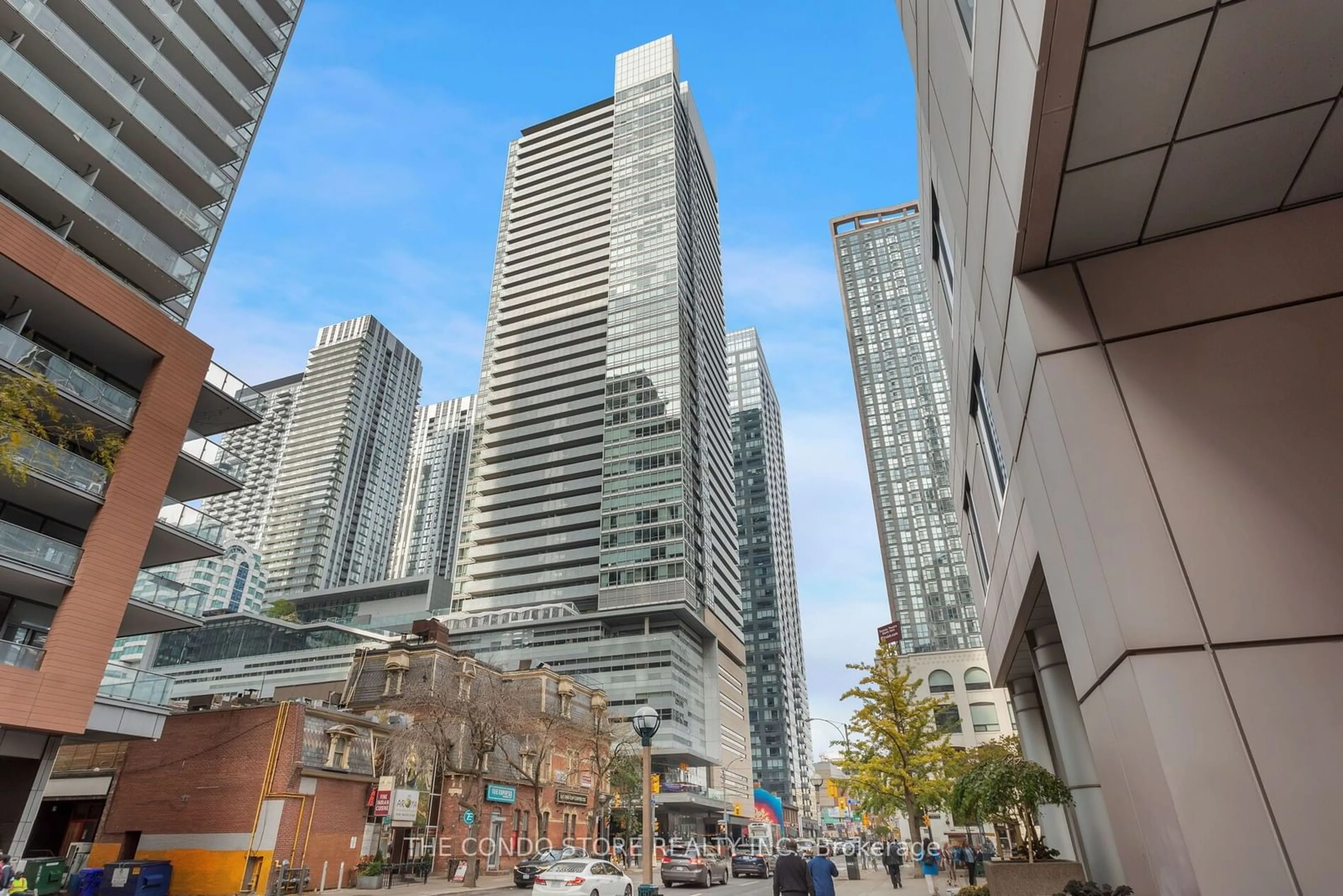 A pic from exterior of the house or condo, the view of city buildings for 80 John St #3201, Toronto Ontario M5V 3X4