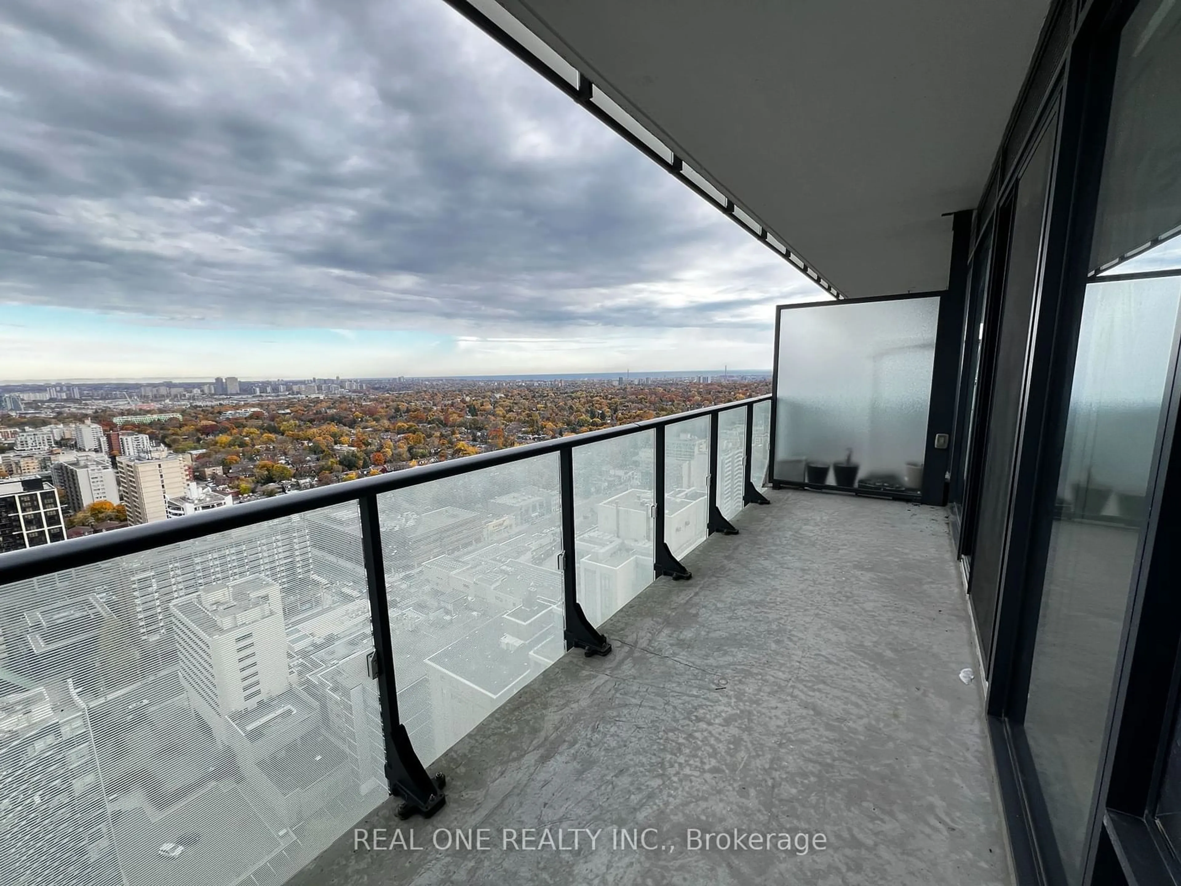 Balcony in the apartment, the view of city buildings for 185 Roehampton Ave #2907, Toronto Ontario M4P 1R4