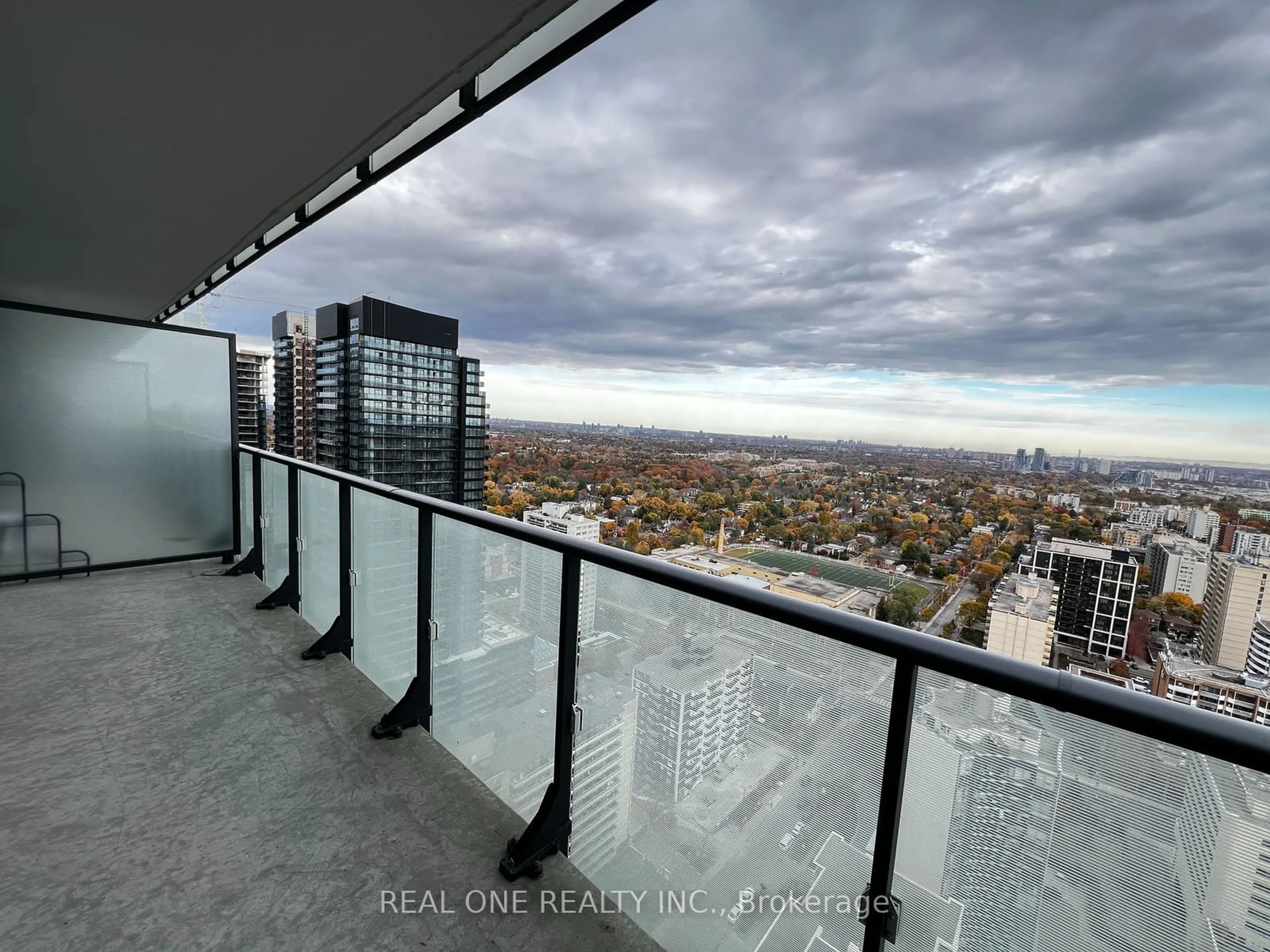 Balcony in the apartment, the view of city buildings for 185 Roehampton Ave #2907, Toronto Ontario M4P 1R4