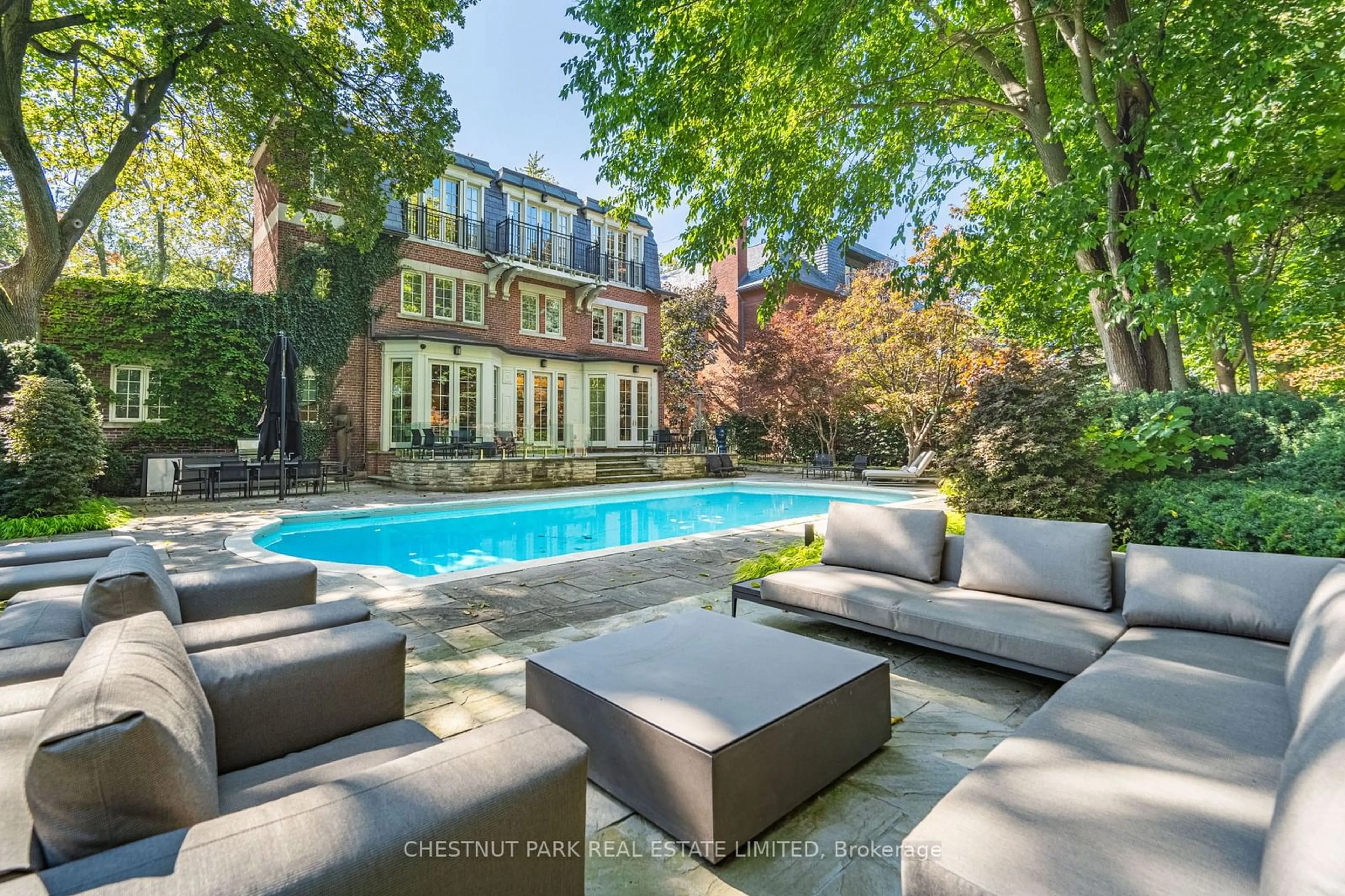 Patio, the fenced backyard for 82 Chestnut Park Rd, Toronto Ontario M4W 2R3