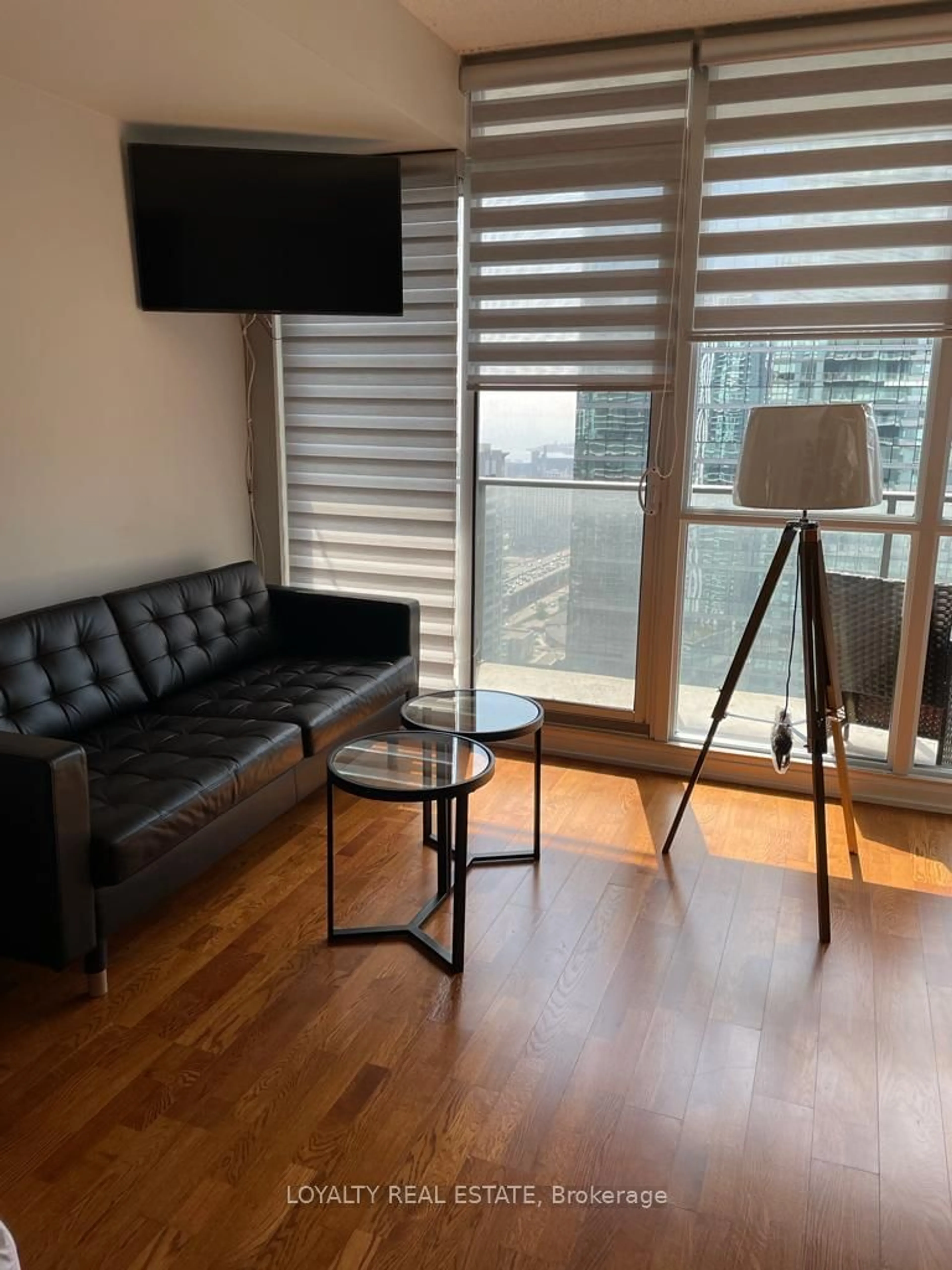 A pic of a room, wood floors for 65 Bremner Blvd #3503, Toronto Ontario M5J 0A7