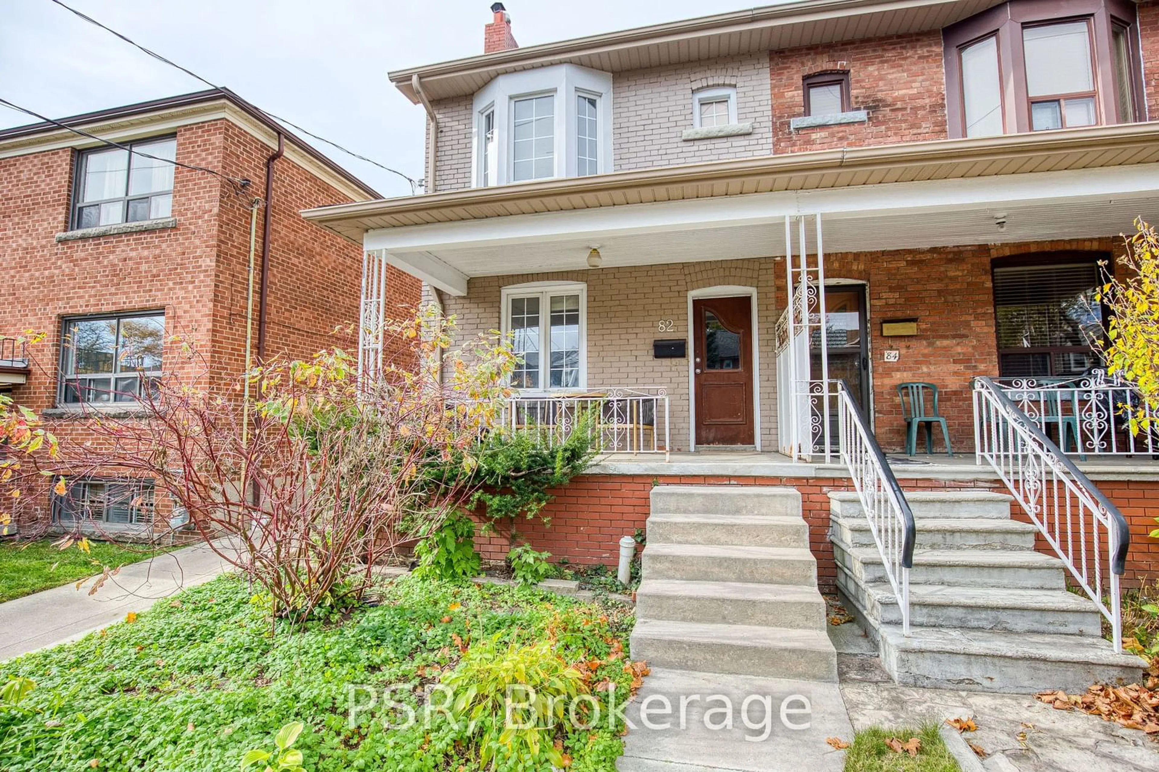 Home with brick exterior material for 82 Greensides Ave, Toronto Ontario M6G 3P7