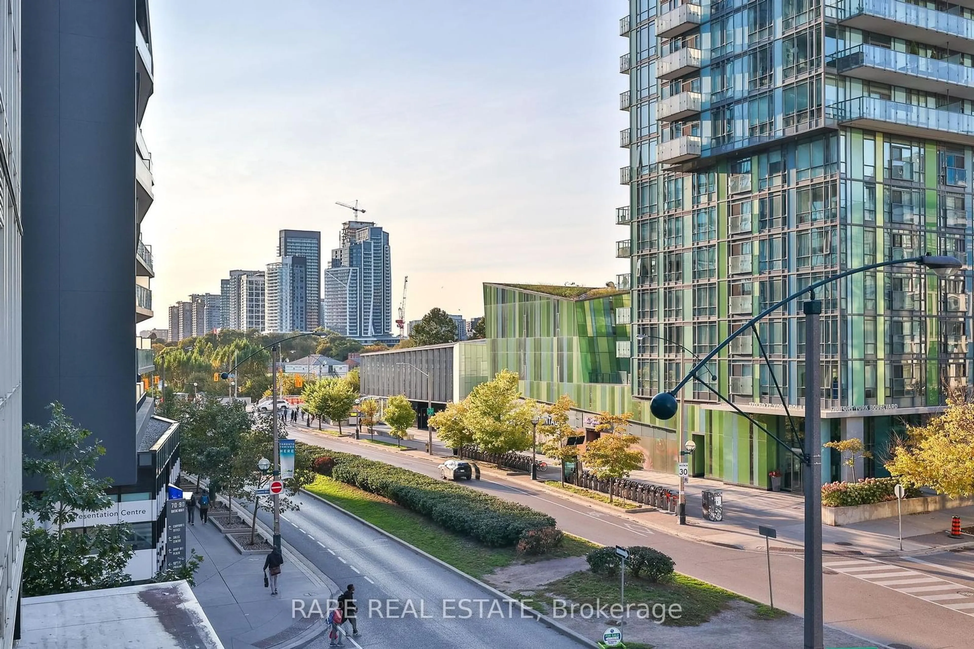 A pic from exterior of the house or condo, the view of city buildings for 85 Queens Wharf Rd #308, Toronto Ontario M5V 0J9