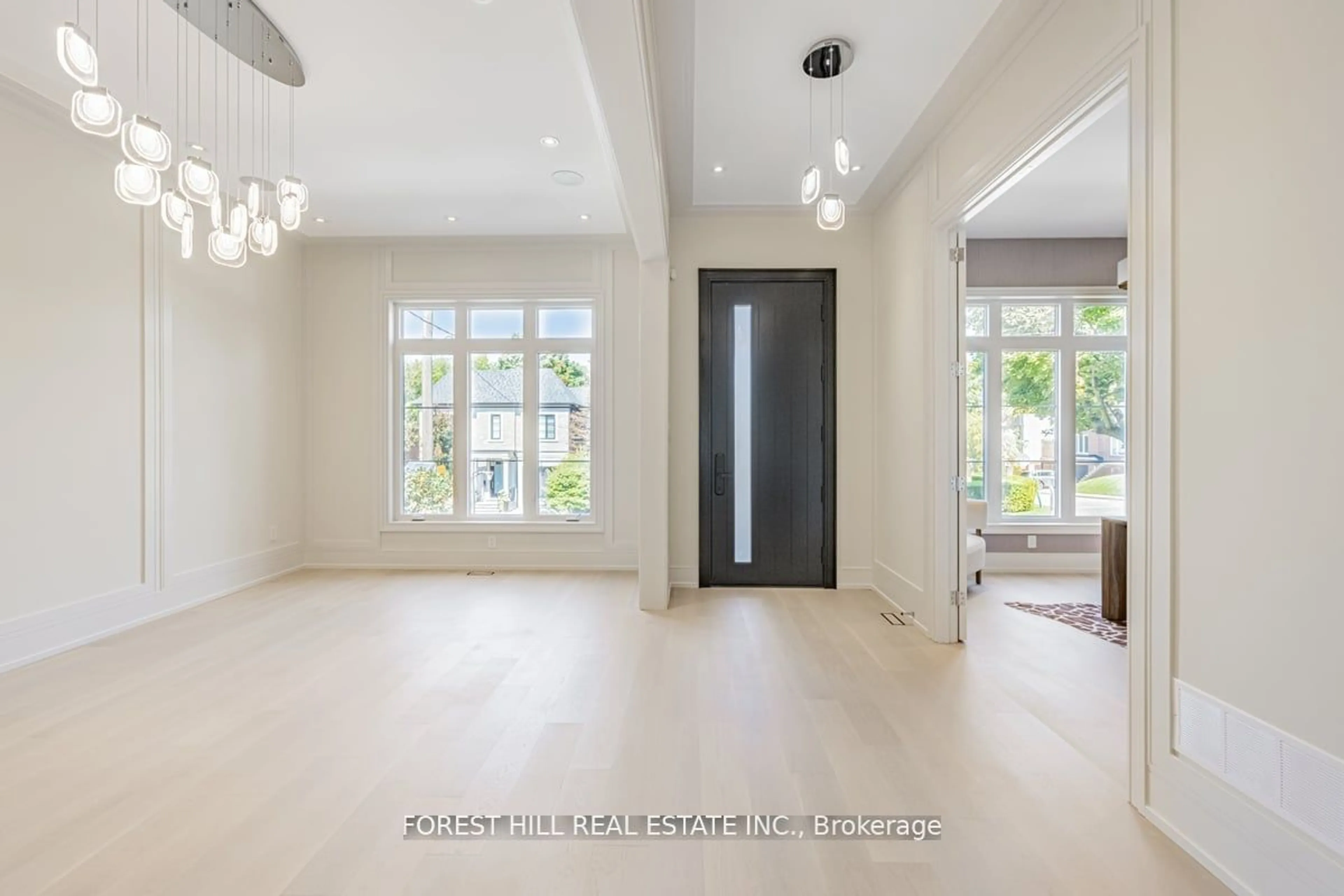 Indoor foyer, wood floors for 115 Dewbourne Ave, Toronto Ontario M6C 1Y6