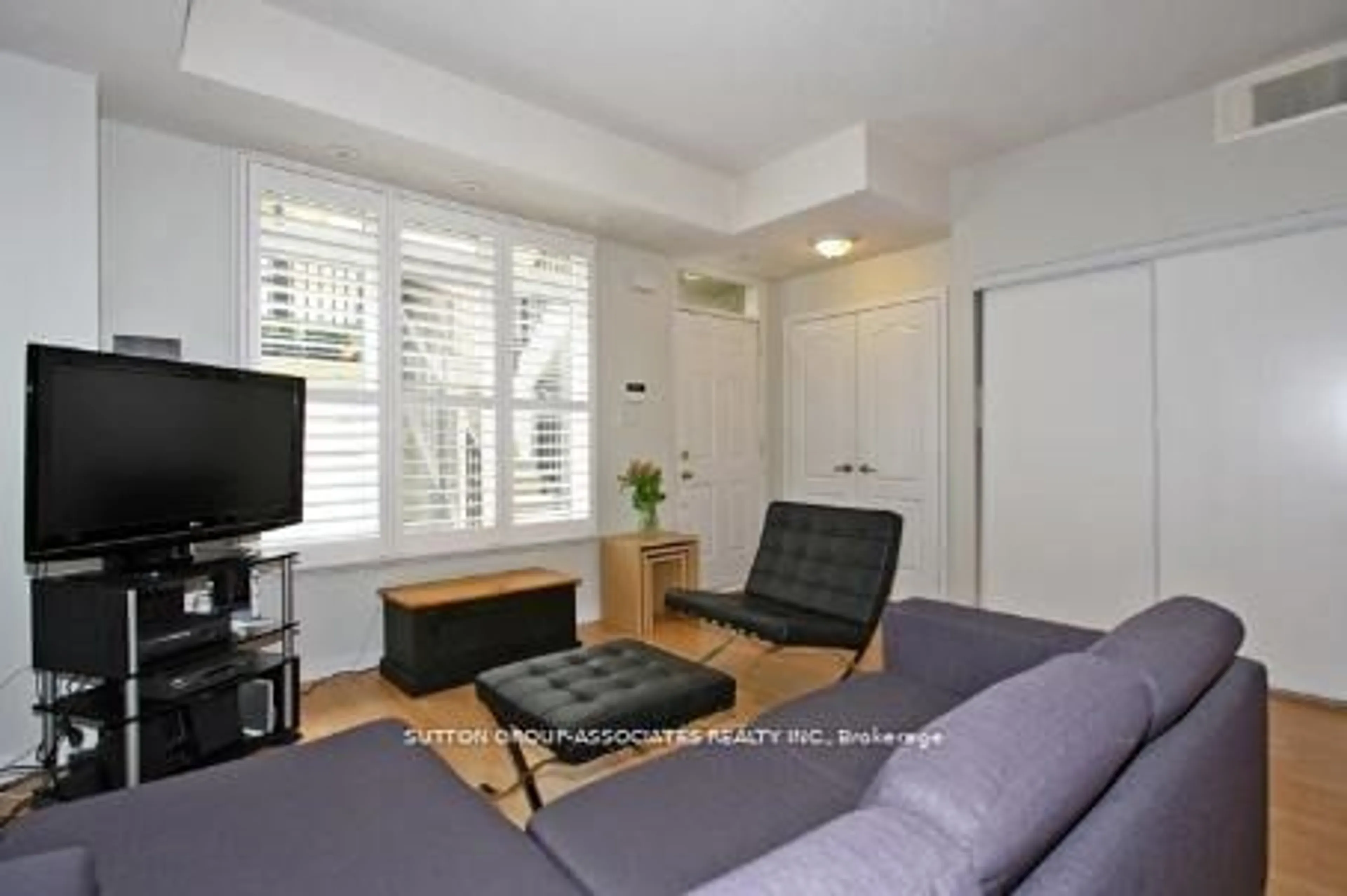 Living room, wood floors for 88 Carr St #TH19, Toronto Ontario M5T 1B7